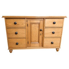 A Victorian English waxed pine dresser base or server w/ 6 drawers