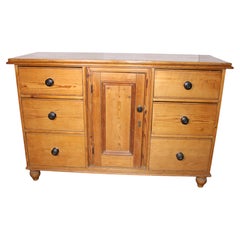 A Victorian English waxed pine dresser base or server w/ 6 drawers
