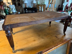 French regency style Mahogany coffee table with fluted legs and brass wheels