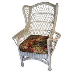 Giant Antique Bar Harbor wicker chair with wings and magazine rack, c. 1910