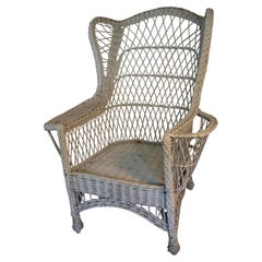 Giant Antique Bar Harbor wicker chair with wings and magazine rack, c. 1910