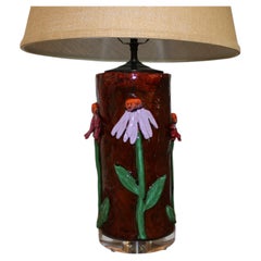 Handmade Pottery lamp of colorful Coneflowers on a lucite base.