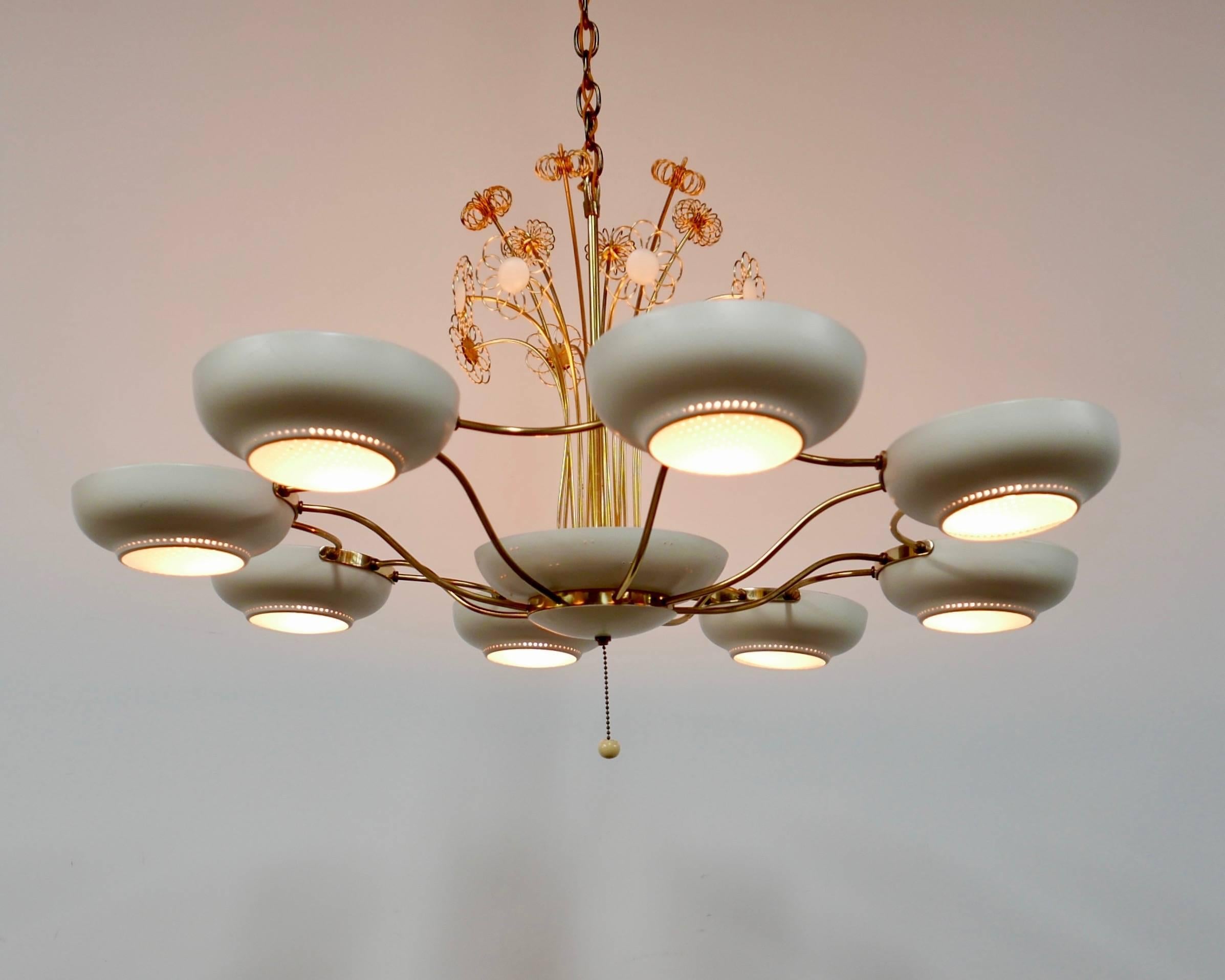 This decorative fixture offers both up and down light to accentuate the floral motif.