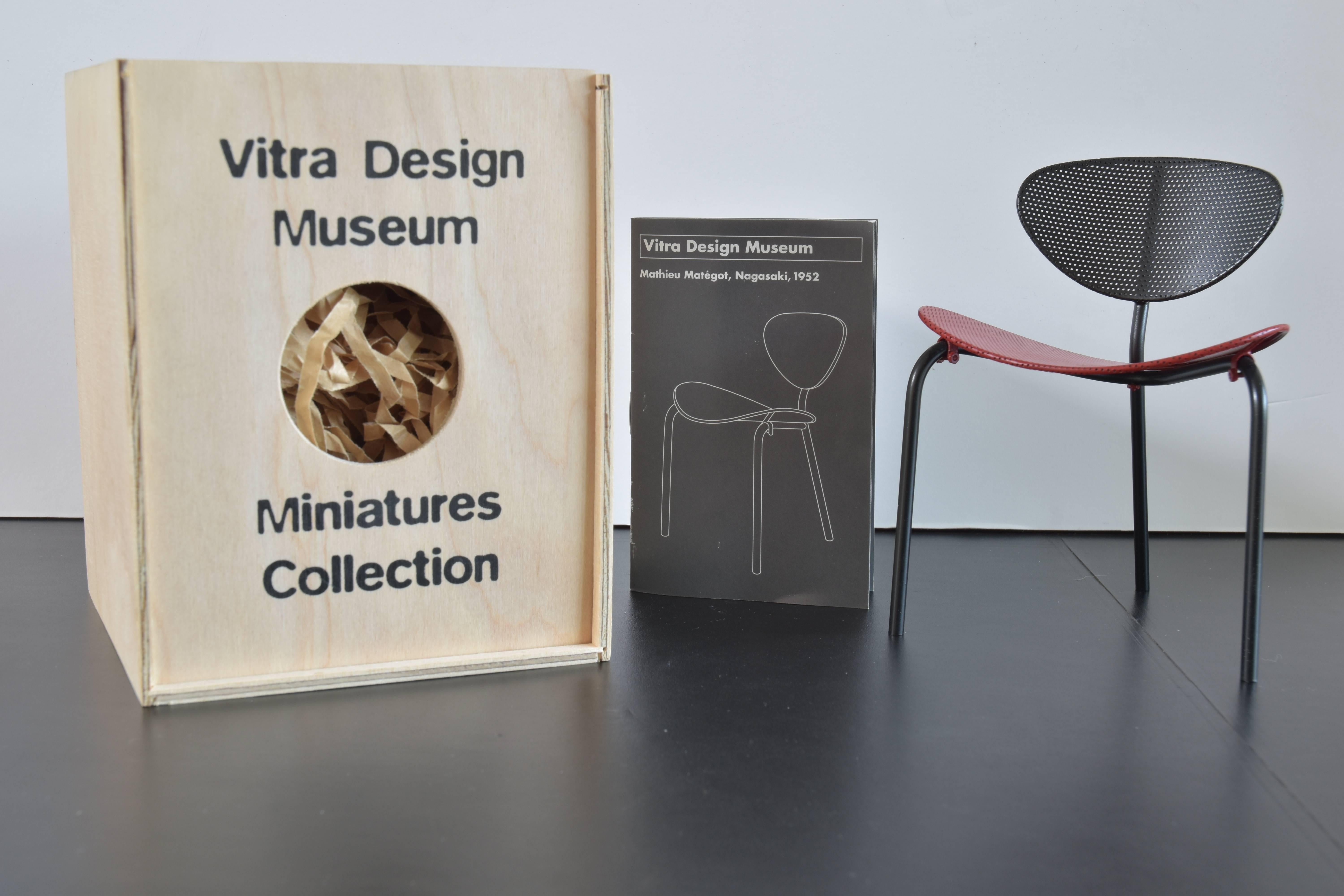 From the Vitra Design Museum collection of miniature chairs a model of the 
Mathieu Matzot Nagasaki chair, 1952.

Included are the model chair, original box and brochure with historical narrative as noted below:

Mathieu Matzot initially took