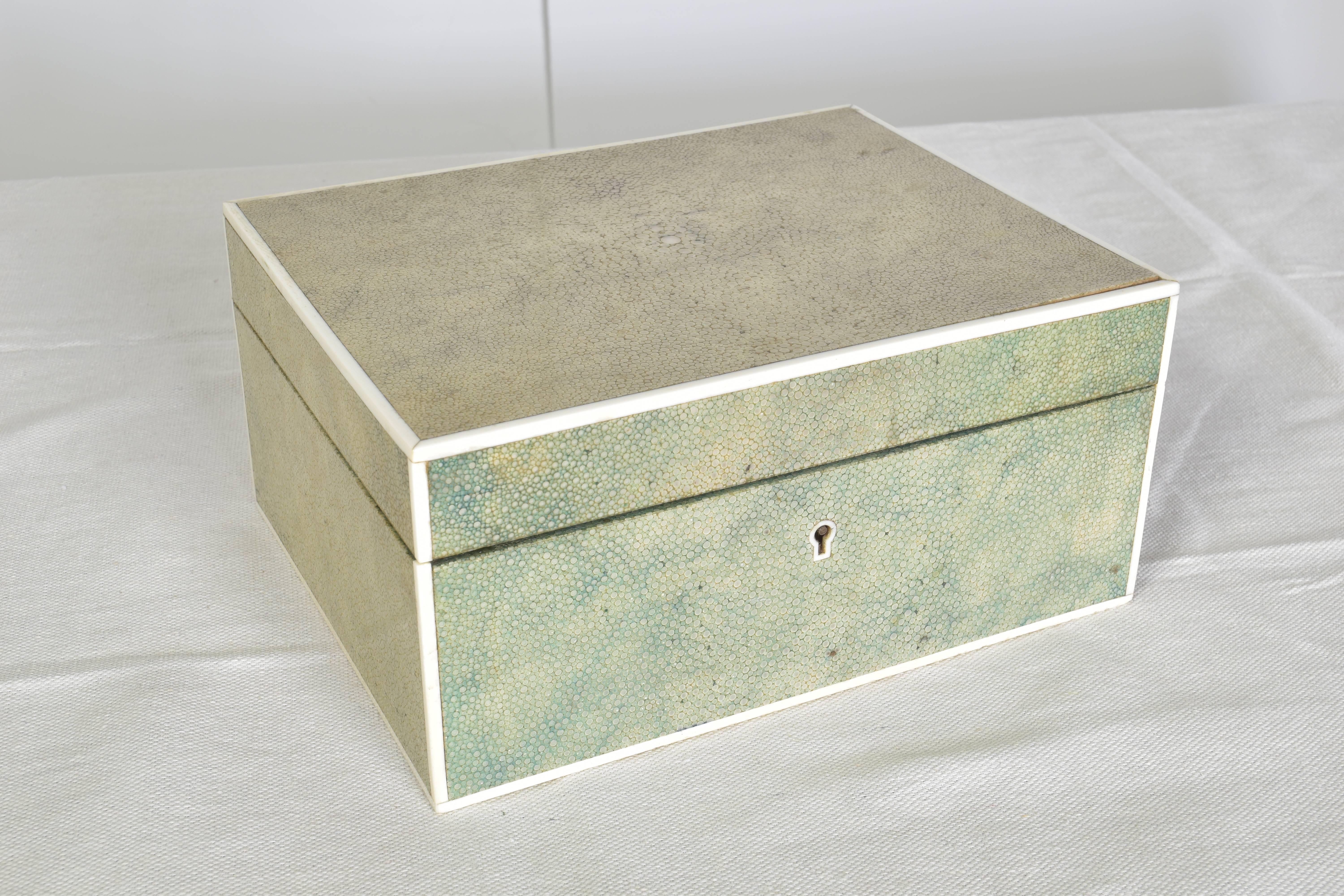 Beautiful hinged shagreen box in a pale green coloration.