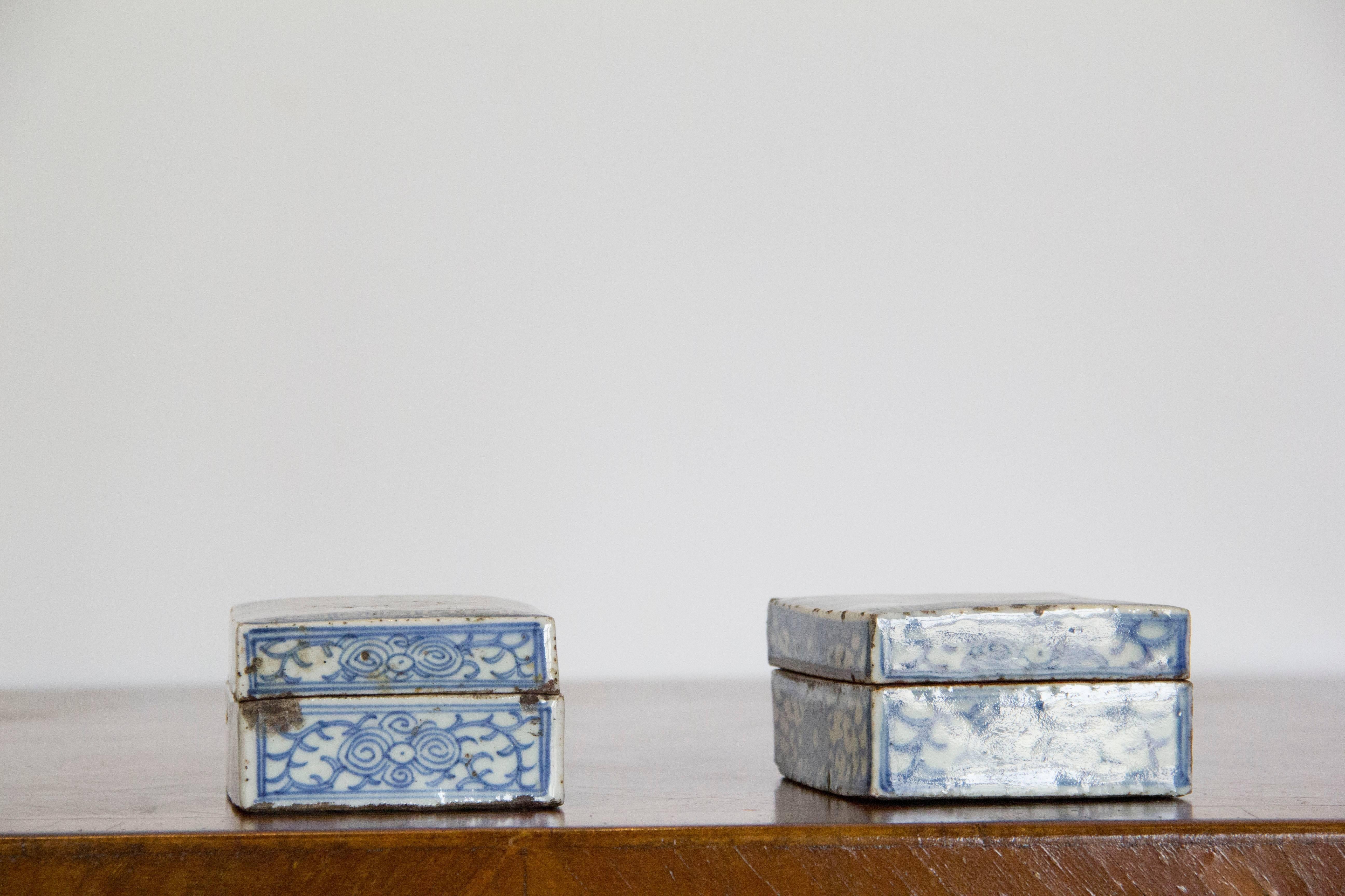 Delicately painted pair of Chinese porcelain boxes with beautifully hand-painted detail.