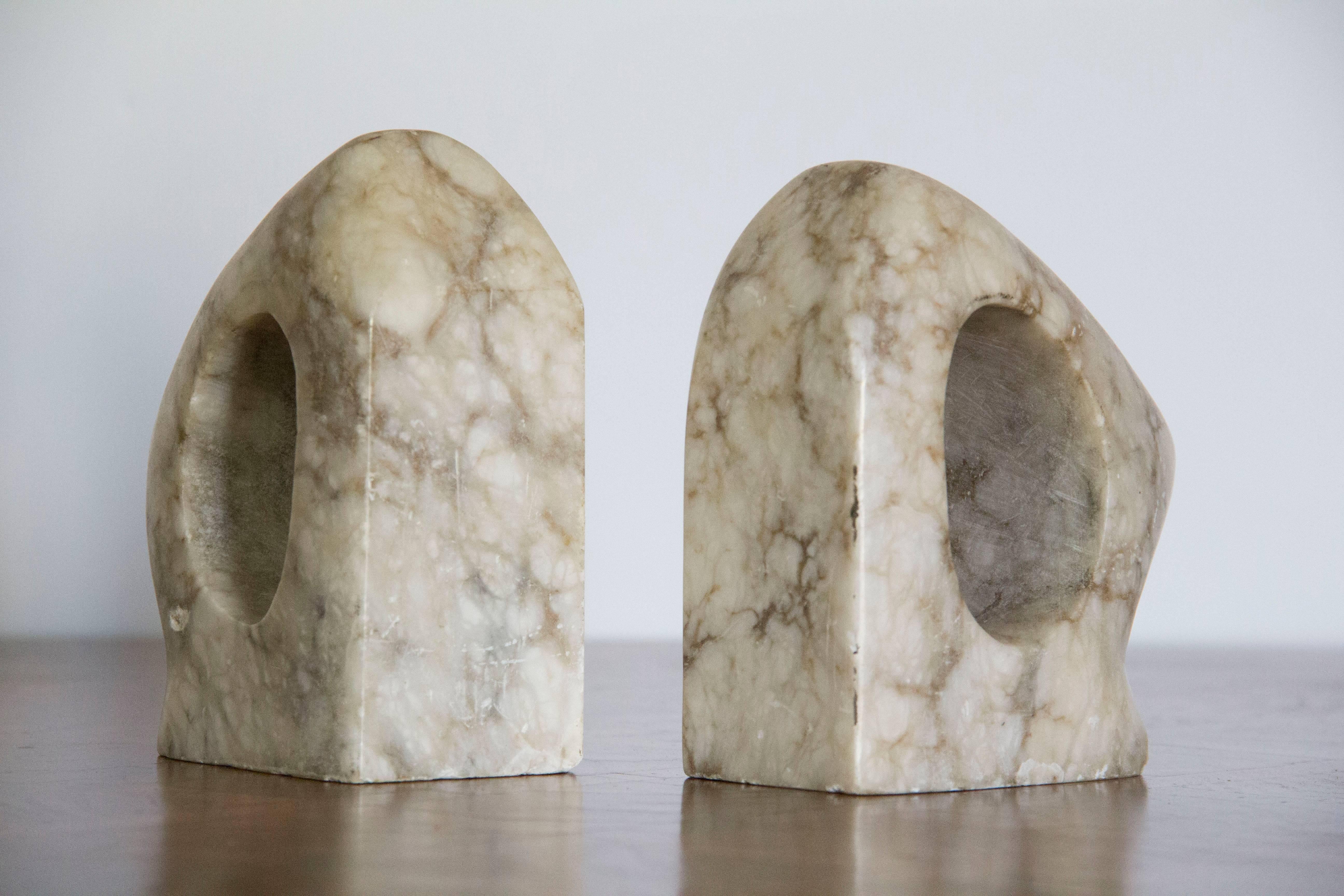 Mid-Century Modern pair of marble bookends with a lovely aged patina.