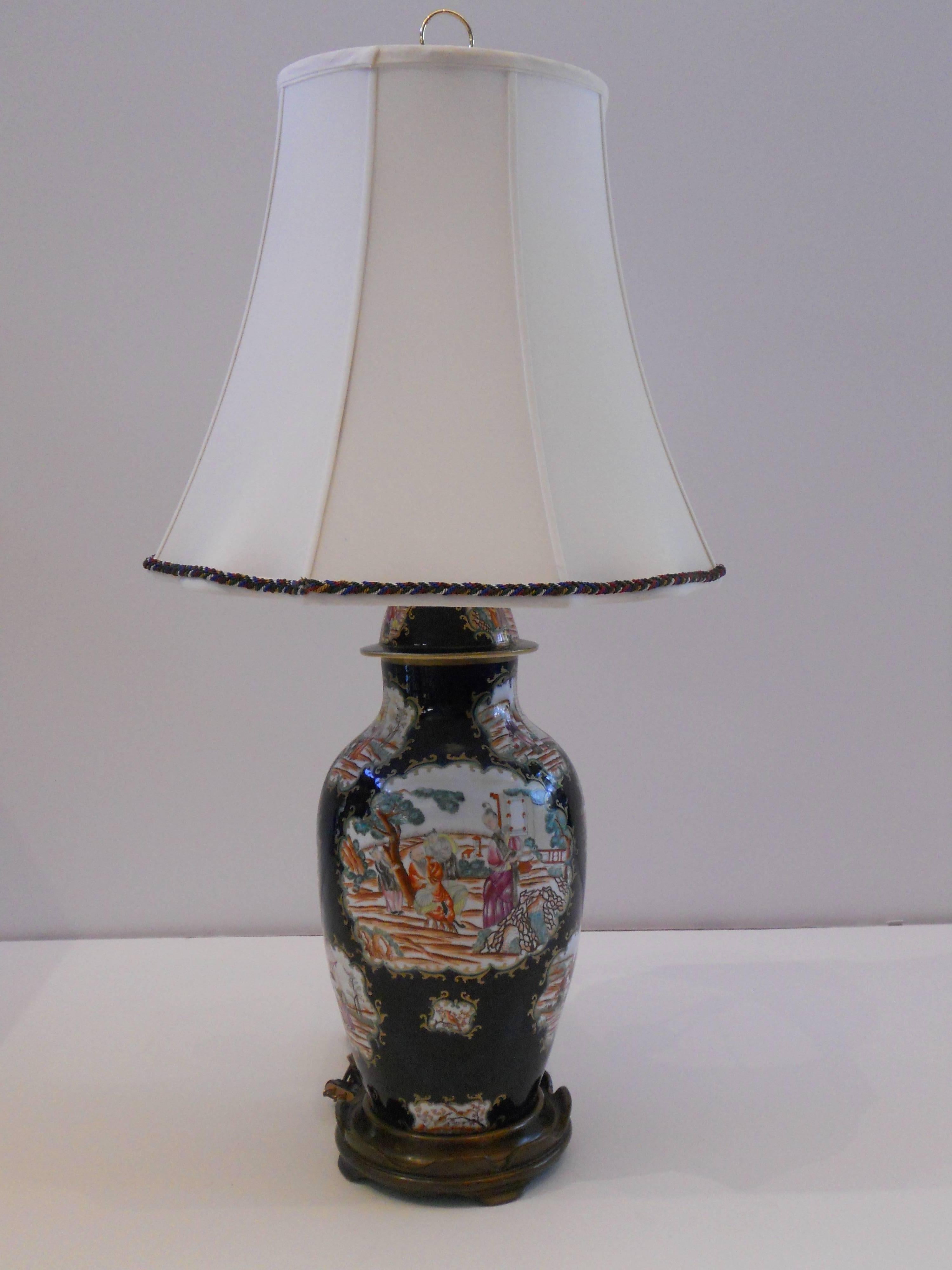 Beautifully painted Chinese export vase wired as a lamp in the 20th century.
Exceptional attention to detail in scenes with elders and children. Each vignette features a unique scene. Additional adornments of prunus, cherry blossoms and plover
