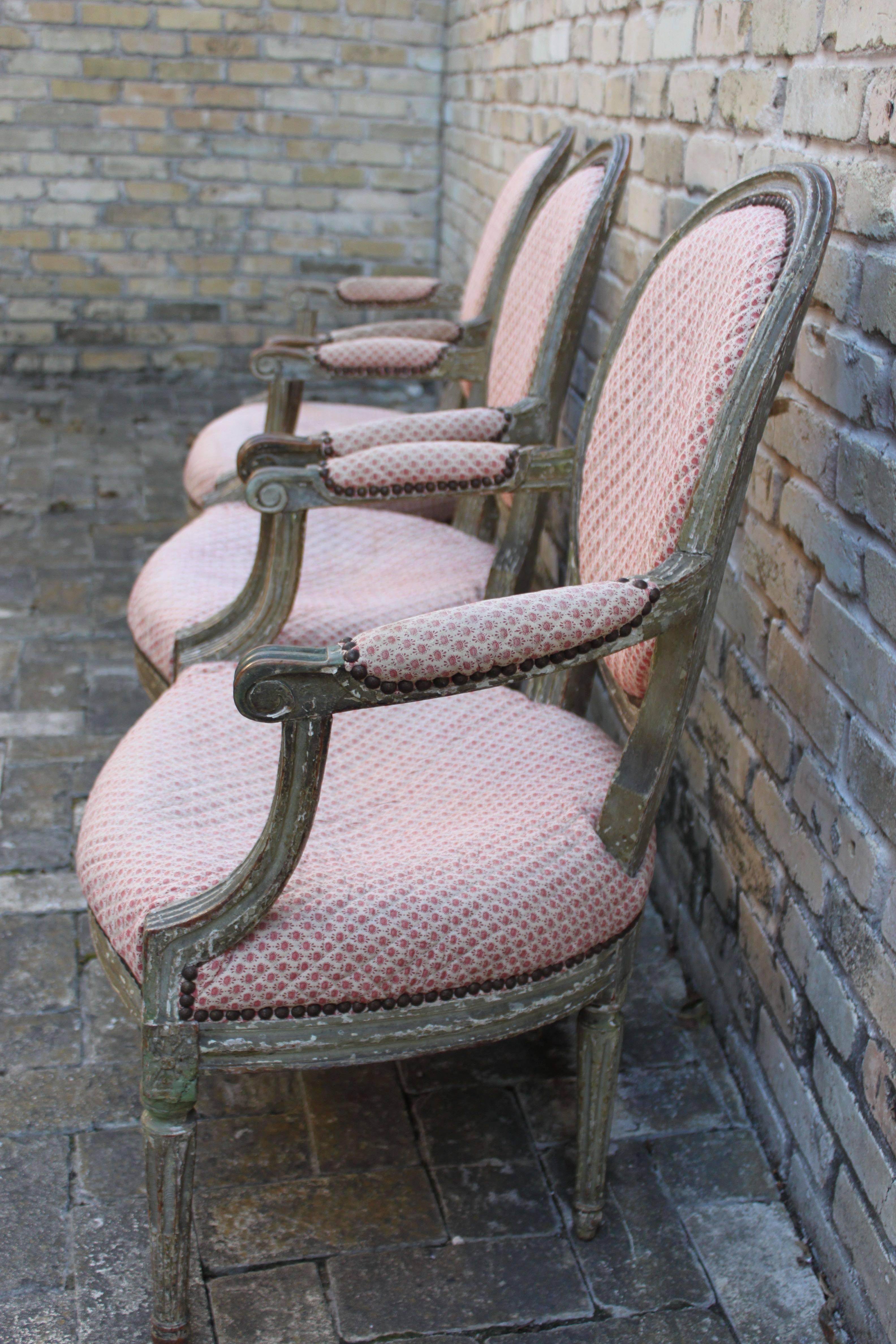 Beautiful set of three period Louis XVI painted fauteuils with nailhead trim. Chairs have a wonderful original painted surface, France, circa 1780-1790.