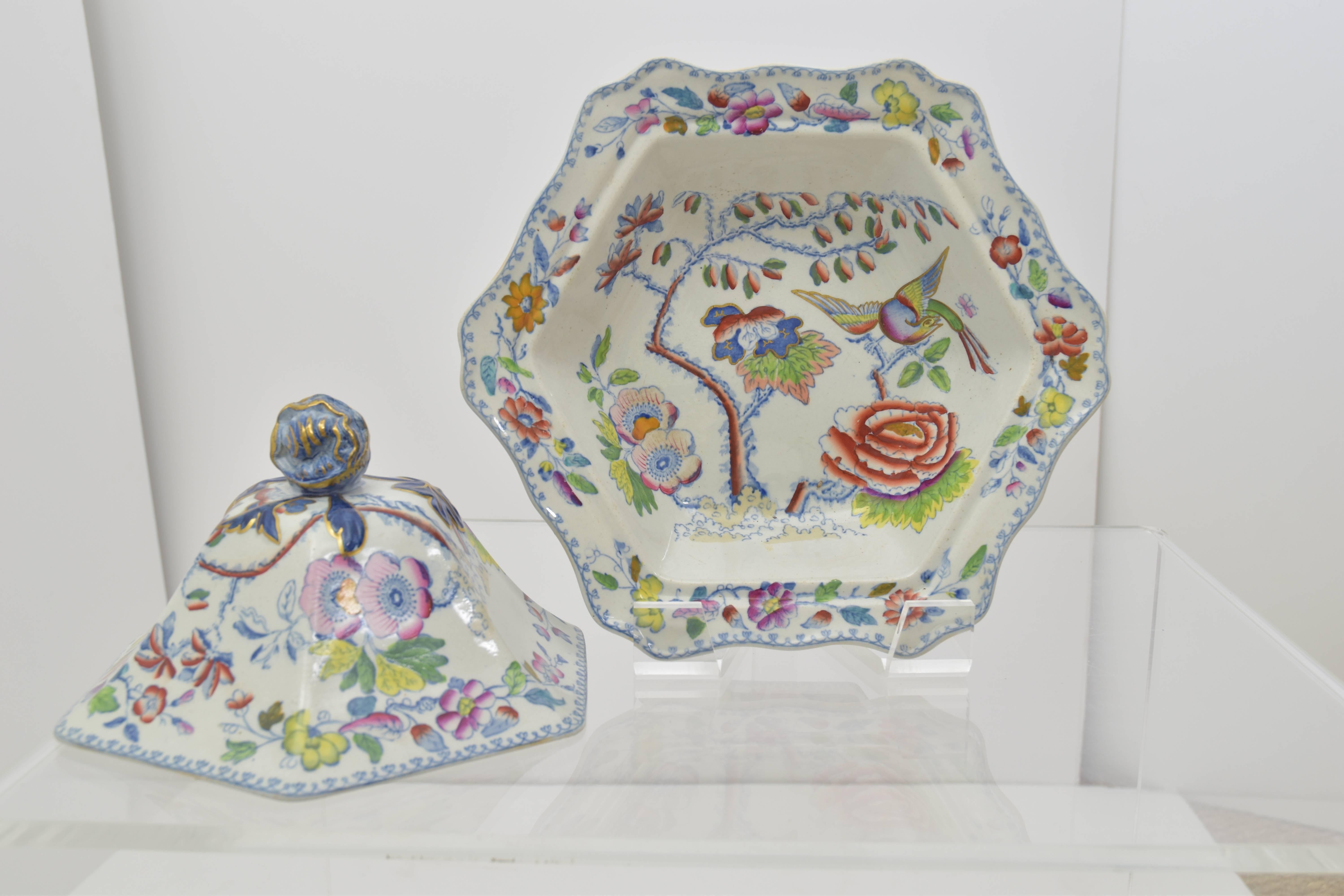 Beautiful antique ironstone covered vegetable dish with a domed lid with flying bird and floral decoration.