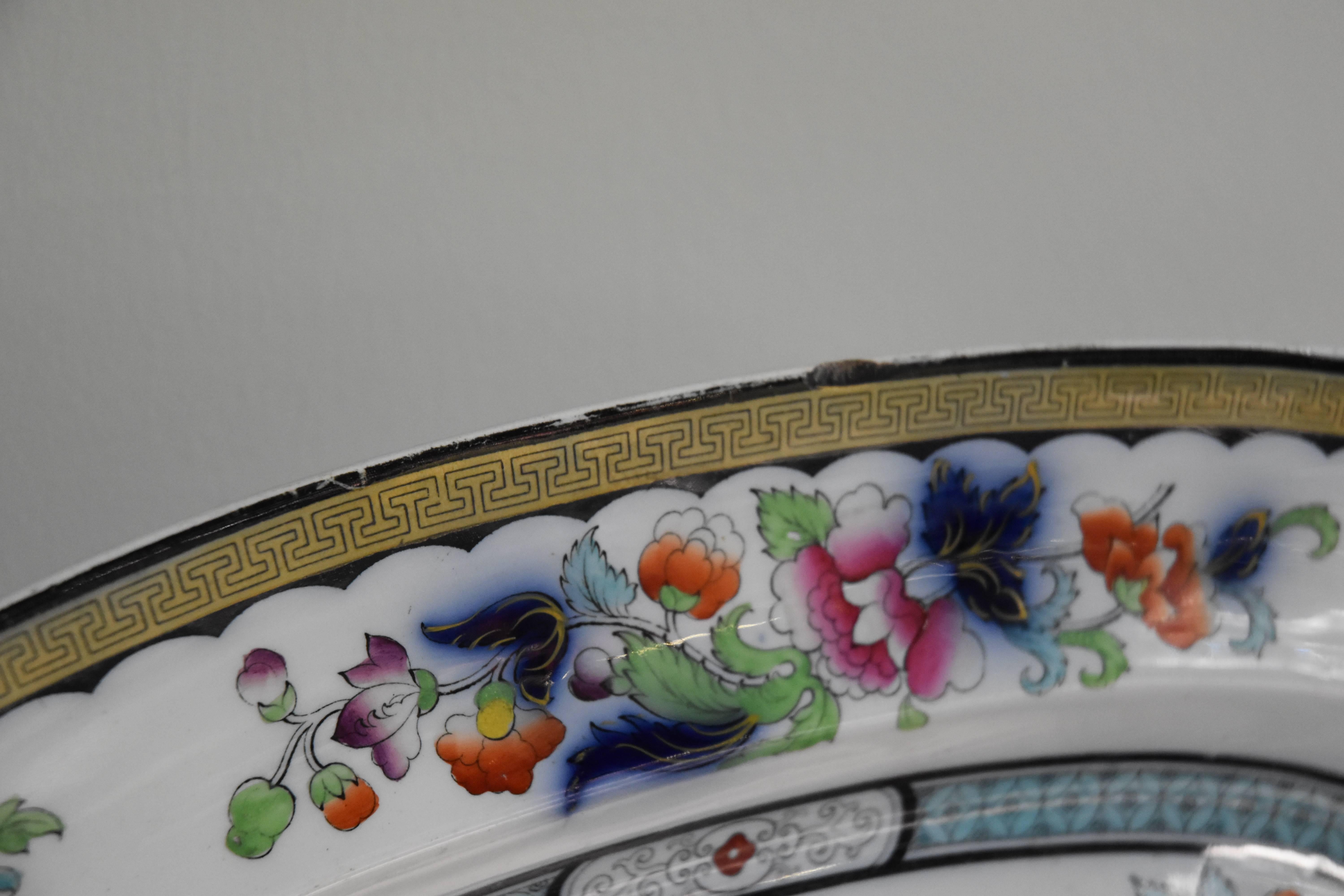 Large platter with floral decoration and Greek key border detail.
 