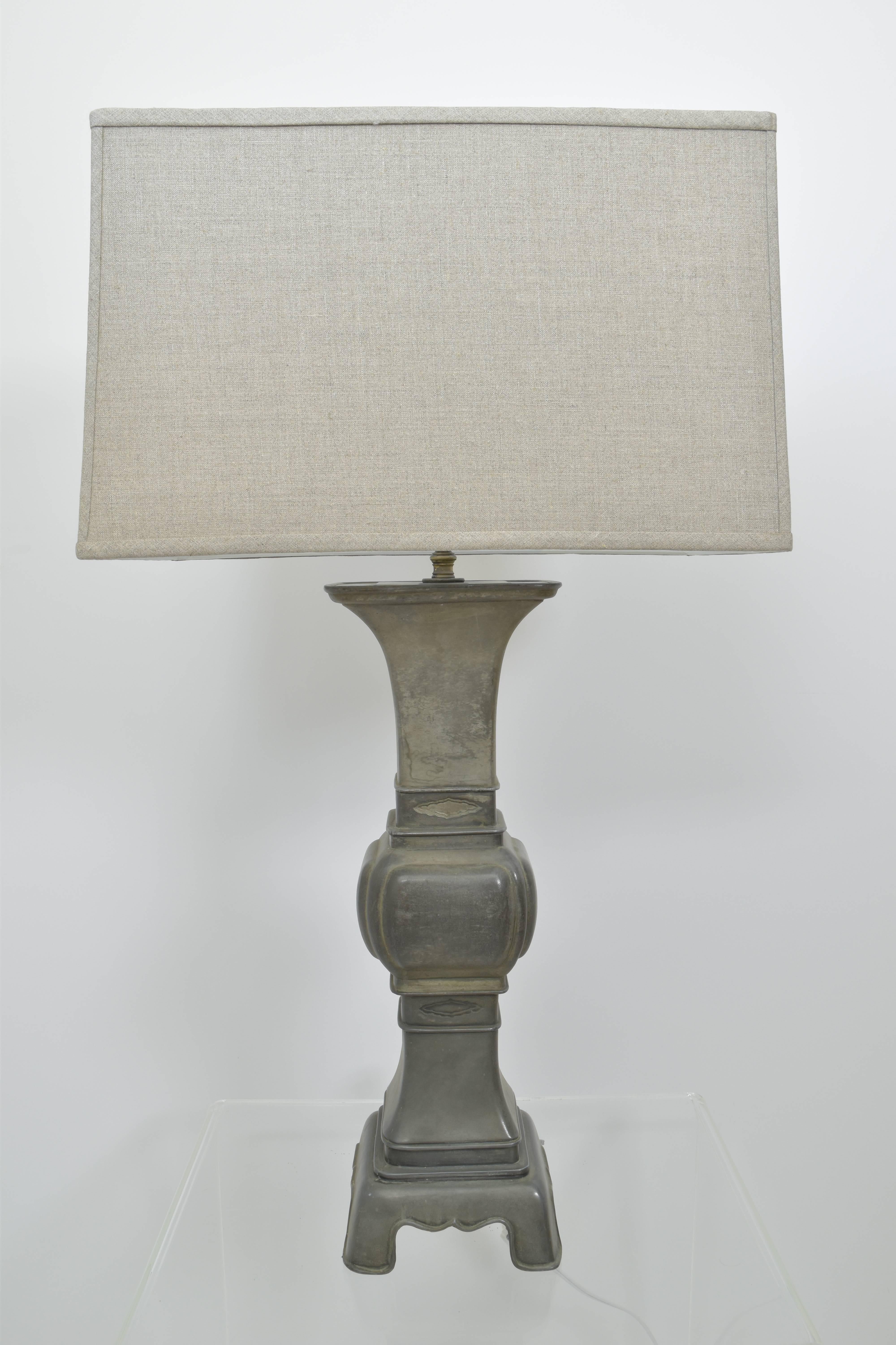 Tall Chinese pewter altar stick as a lamp.  A nicely proportioned lamp with a modern gray linen shade. 

Linen shade measures:
18