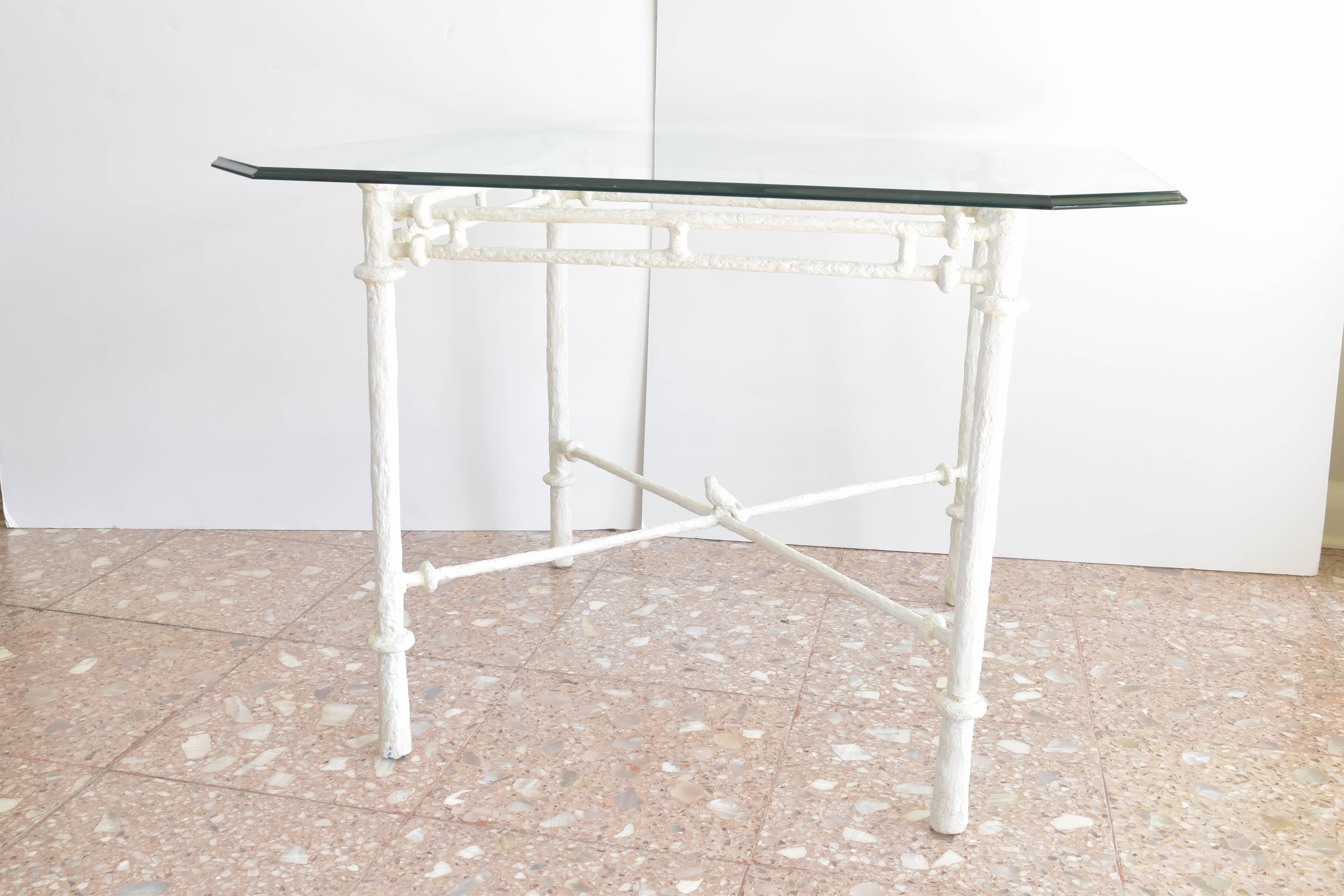 Giacometti glass top table cast in white plaster resin with a perched bird resting atop the x form base.   
Original glass top with beveled edge detail.

Table base measures 28.5