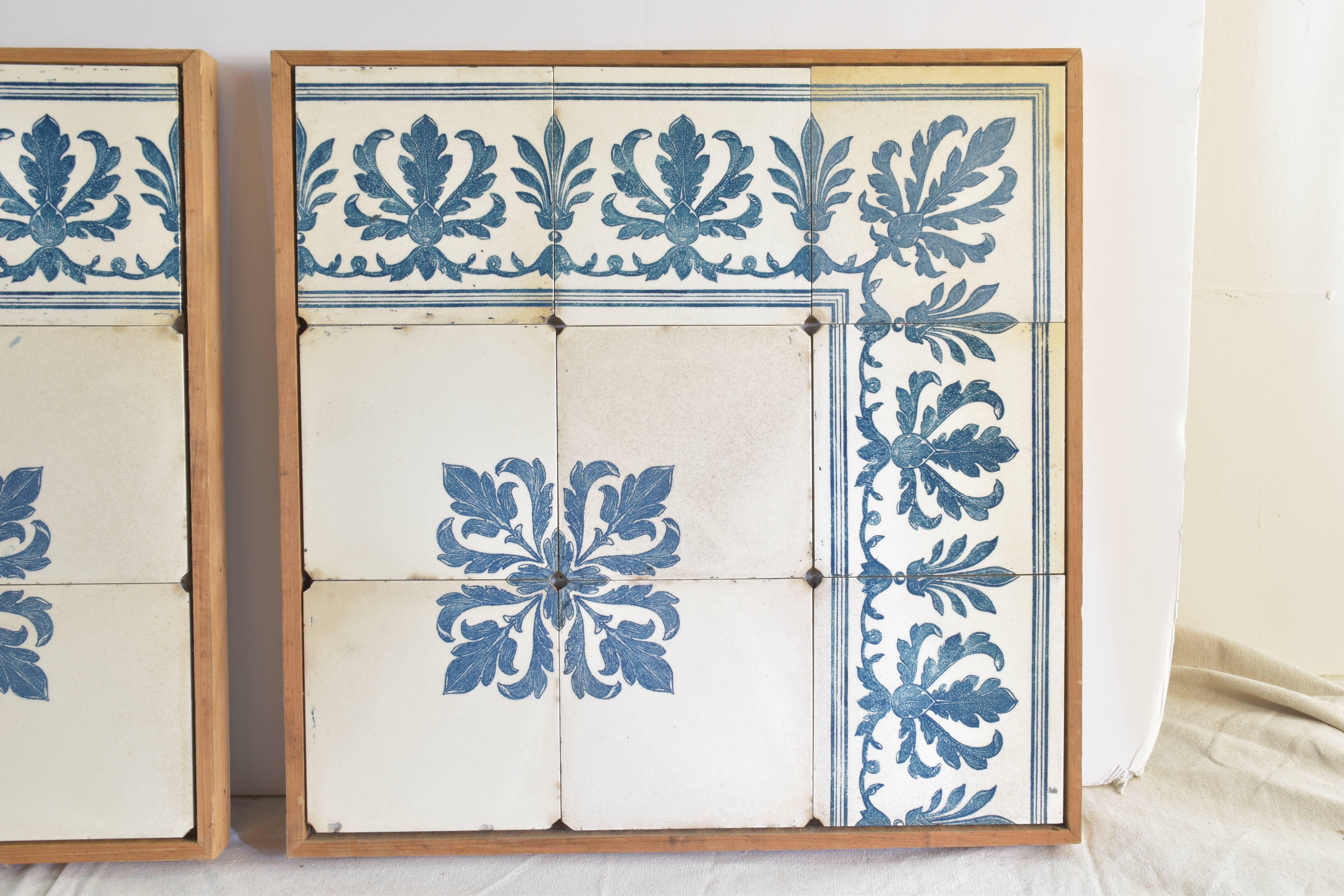 A pair of blue and white tiles in contemporary light wood frames. 
These exceptionally heavy tiles mounted in wood frames display beautifully as a pair.