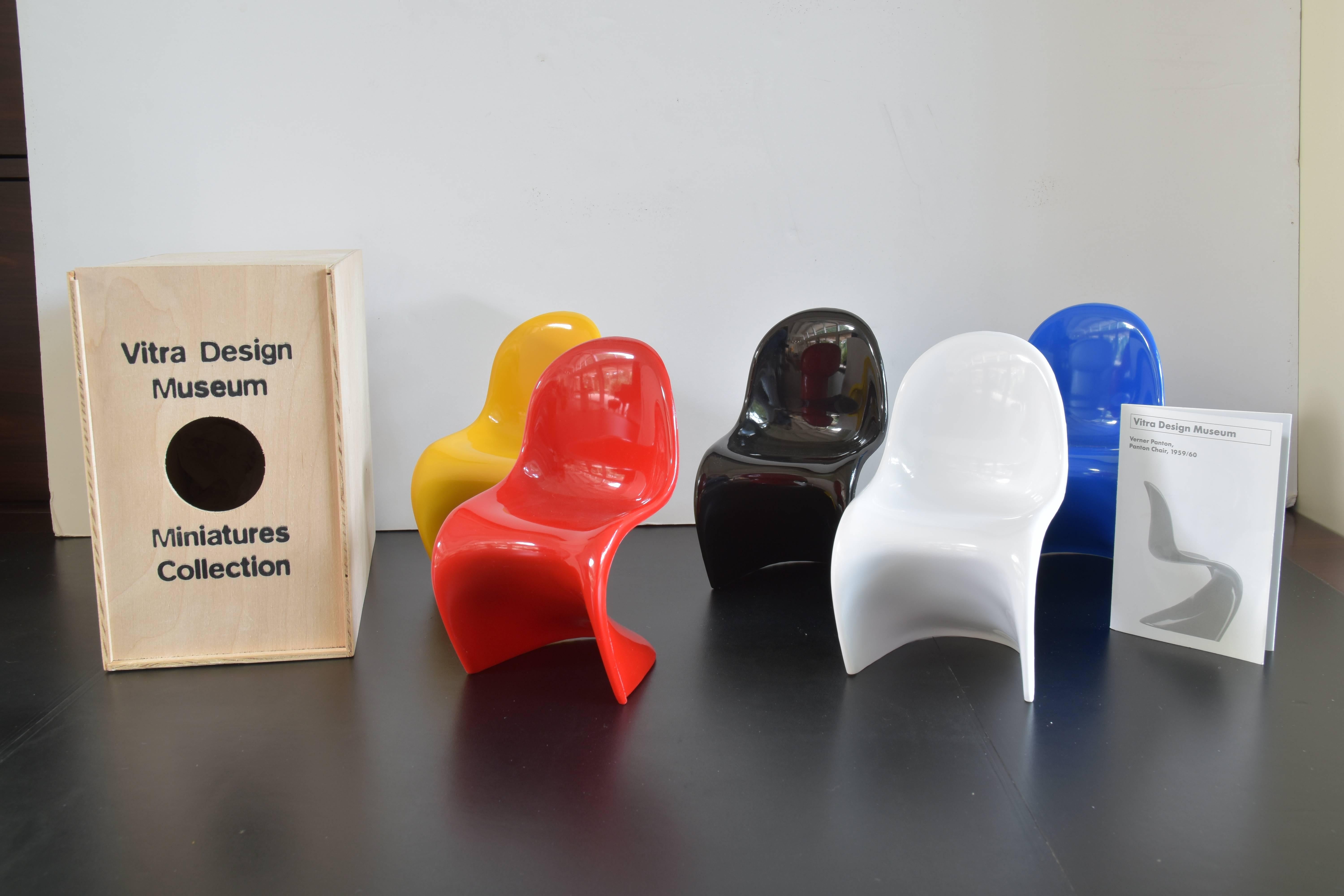 Collection of five Verner Panton miniature chairs in red, white, black, yellow and blue.

These chairs are modeled after the originals by designed by Verner Panton in 1959-1960.

These miniatures are after the original model from the first