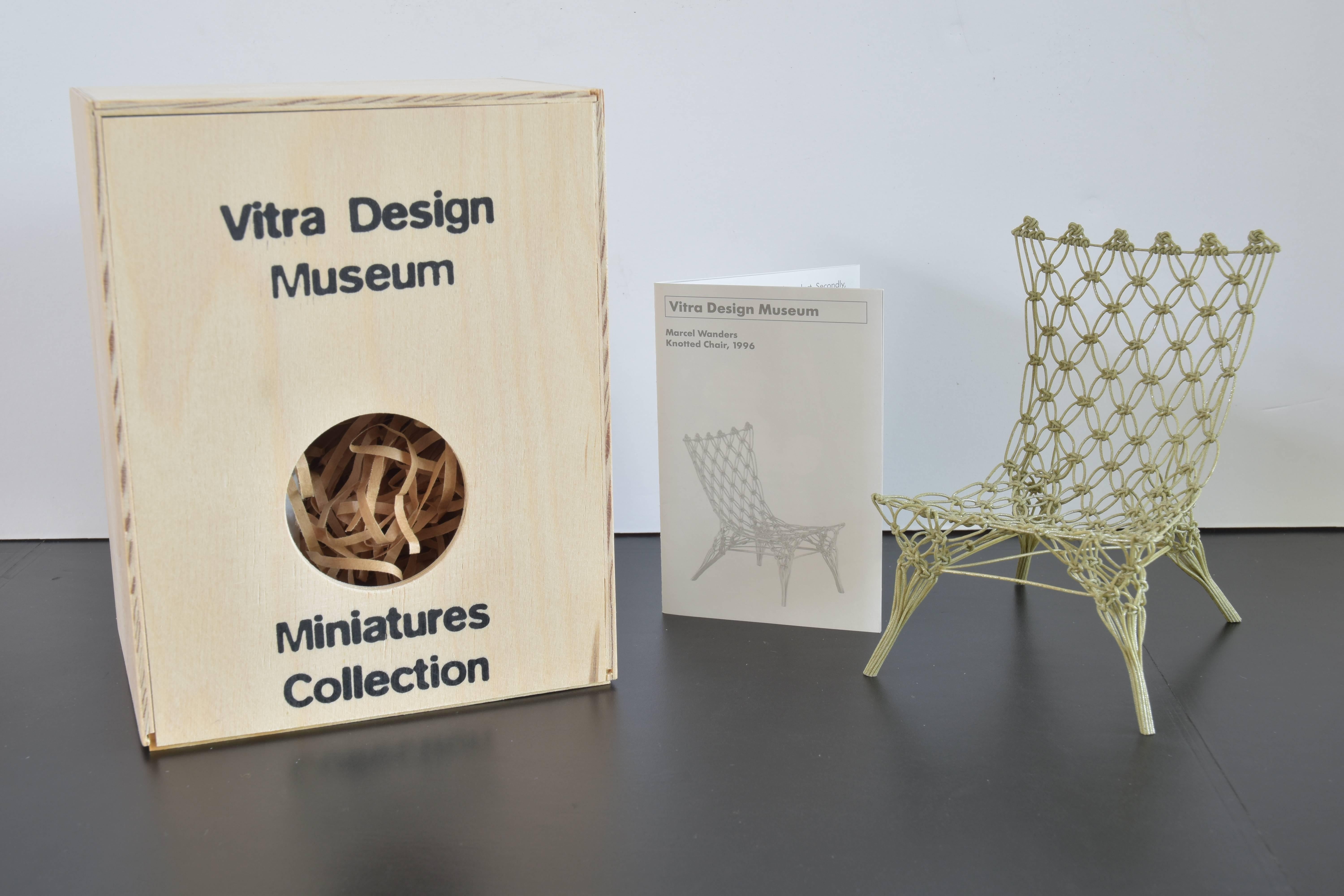 Vitra design museum miniature model of the original Marcel Wanders knotted chair from 1996.

This charming and detailed model includes the original wooden box and historical narrative as noted below:

Marcel Wanders' knotted chair is made from