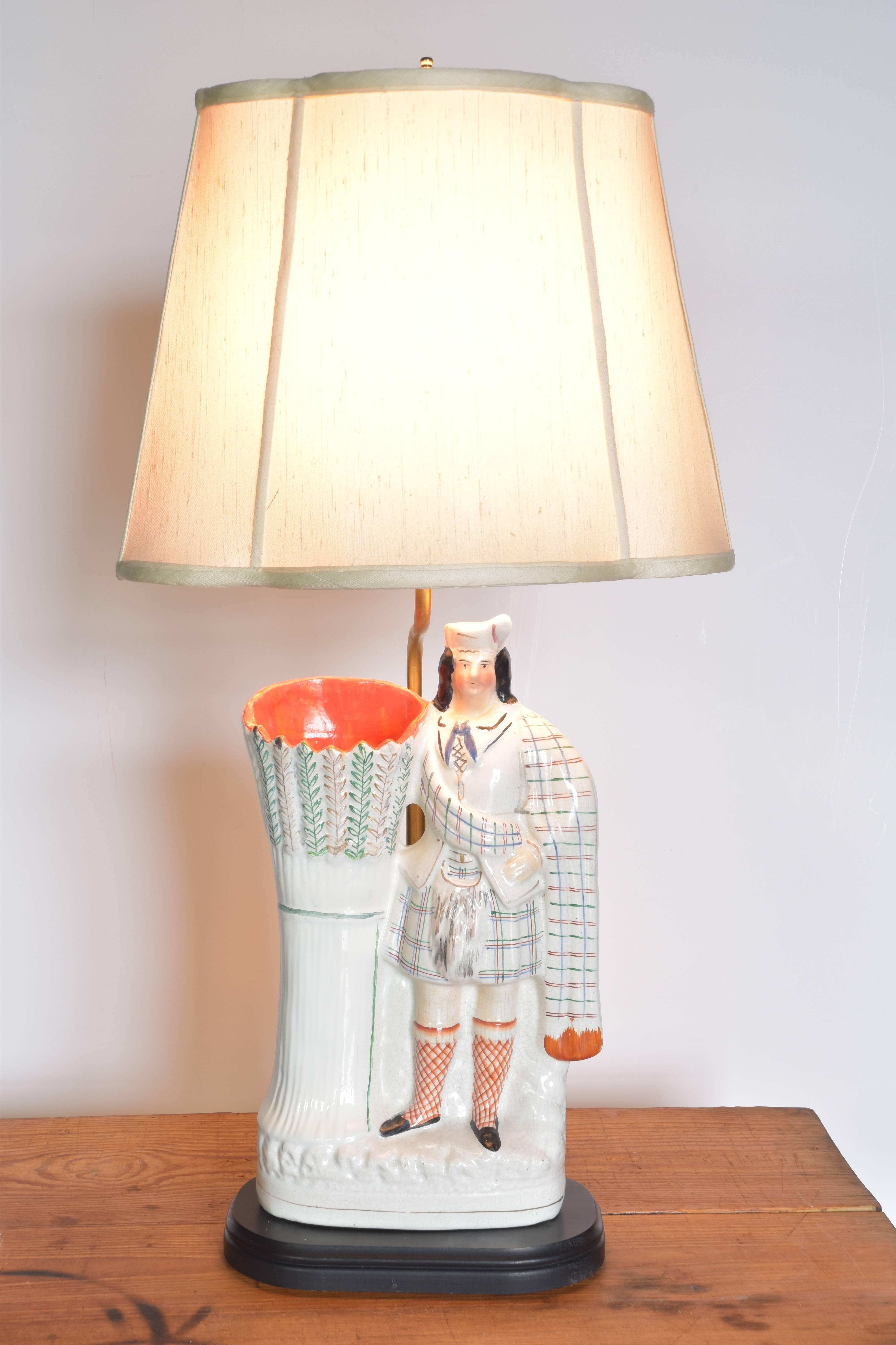 Charming Staffordshire figural spill vase mounted to a wooden base and wired as a lamp.

 