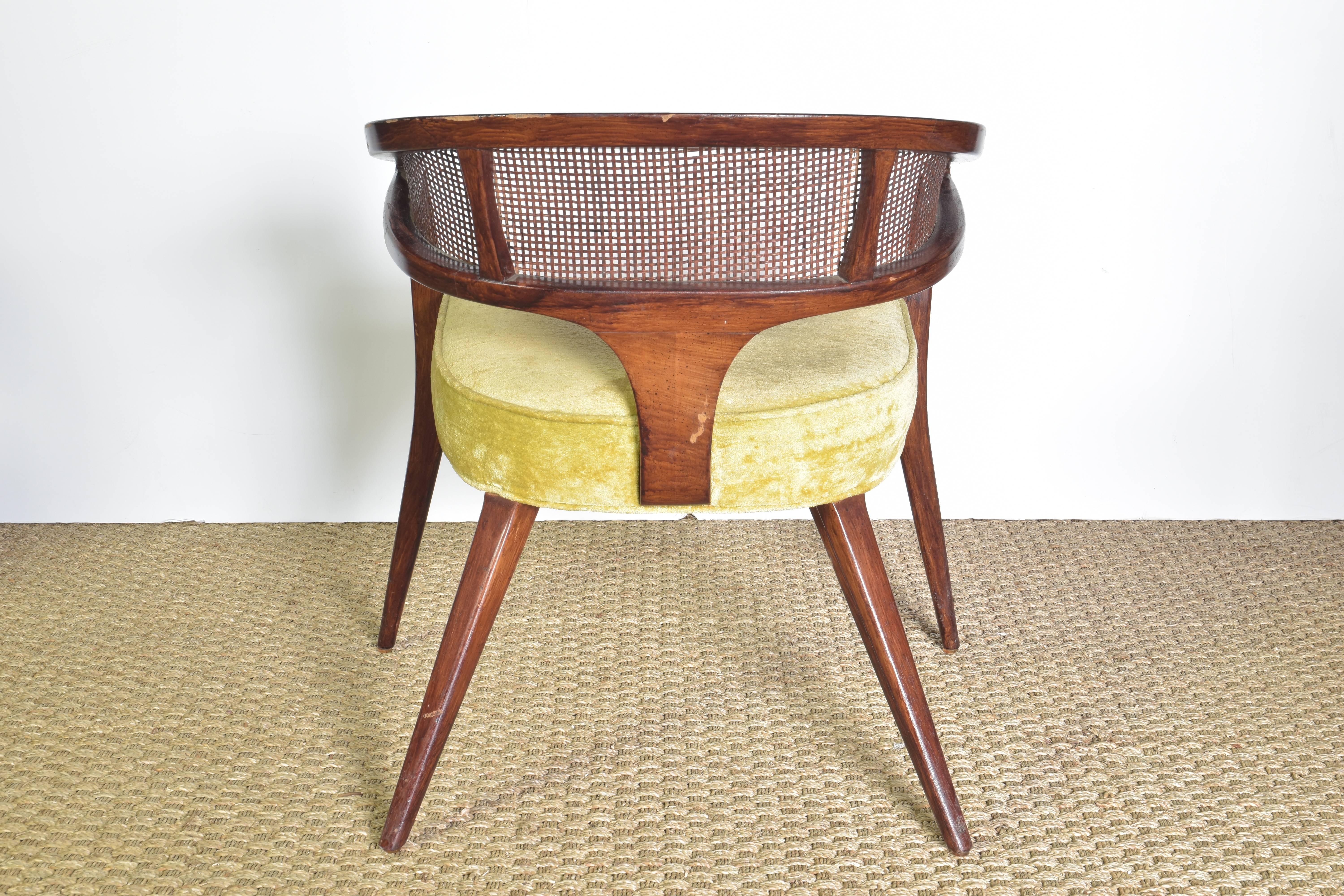 Chic pair of Midcentury chairs with curved backs and original caning.
 