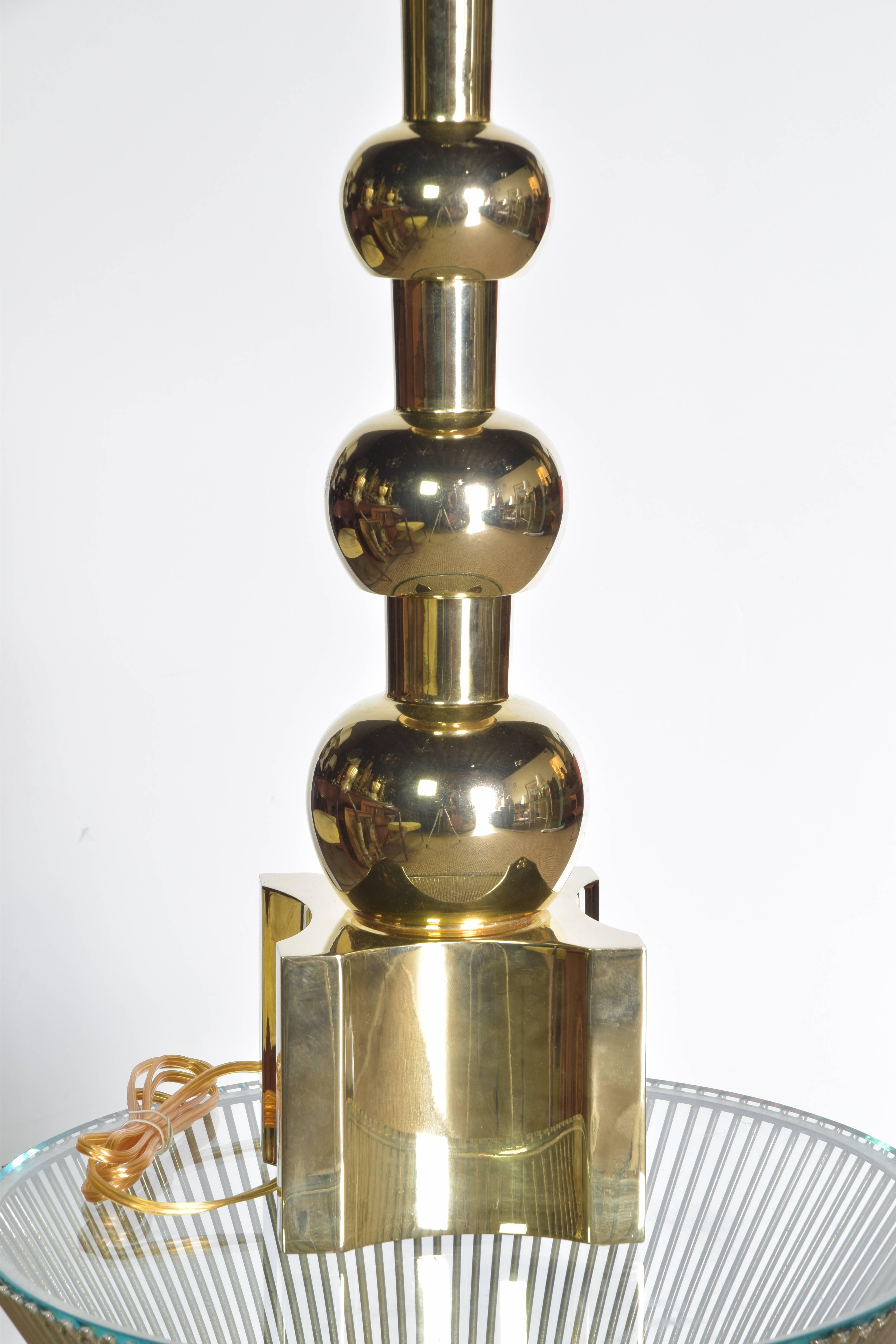 Mid-Century Modern Stiffel brass lamp with a stepped ball design. This unlacquered brass lamp has been perfectly restored with new brass plating and new wiring. 
Lamp measures 33
