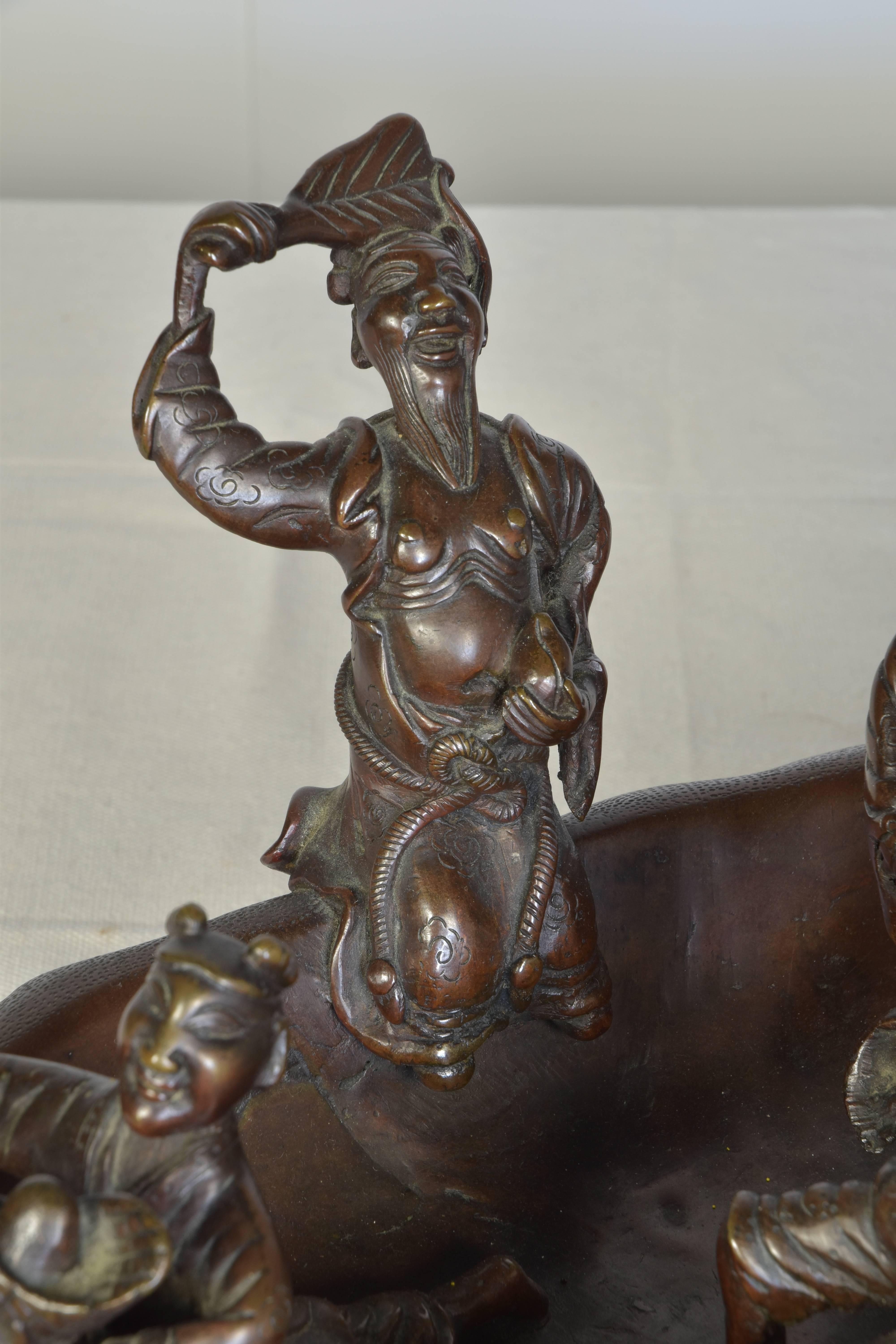 Chinese Cast Bronze Sculpture of Men in a Boat on a Carved Wooden Base, Signed For Sale