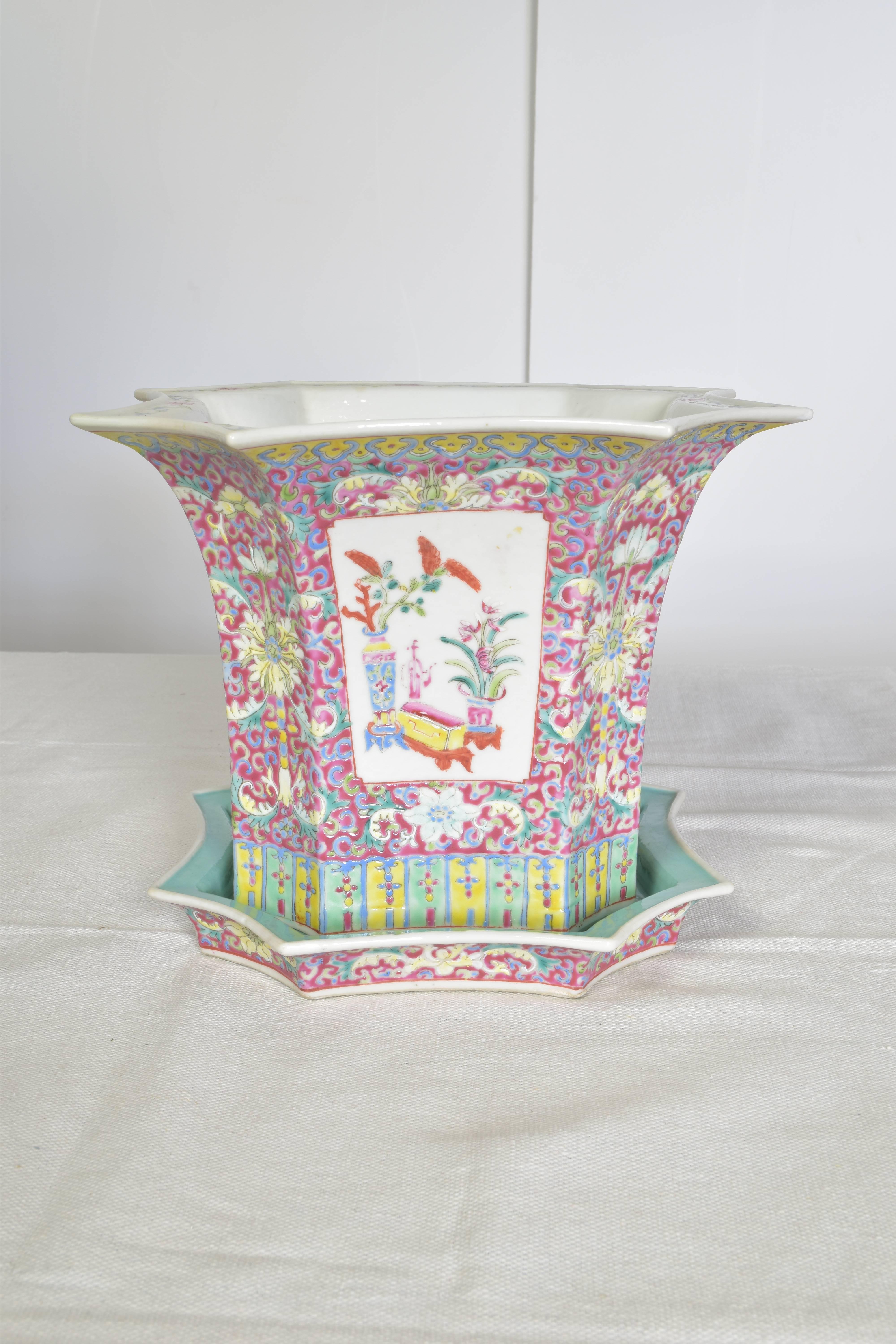 Lovely pair of hand-painted Chinese cachepot. The pair feature hand-painted floral decoration in shades of aqua, rose, yellow and white and are signed at the base.