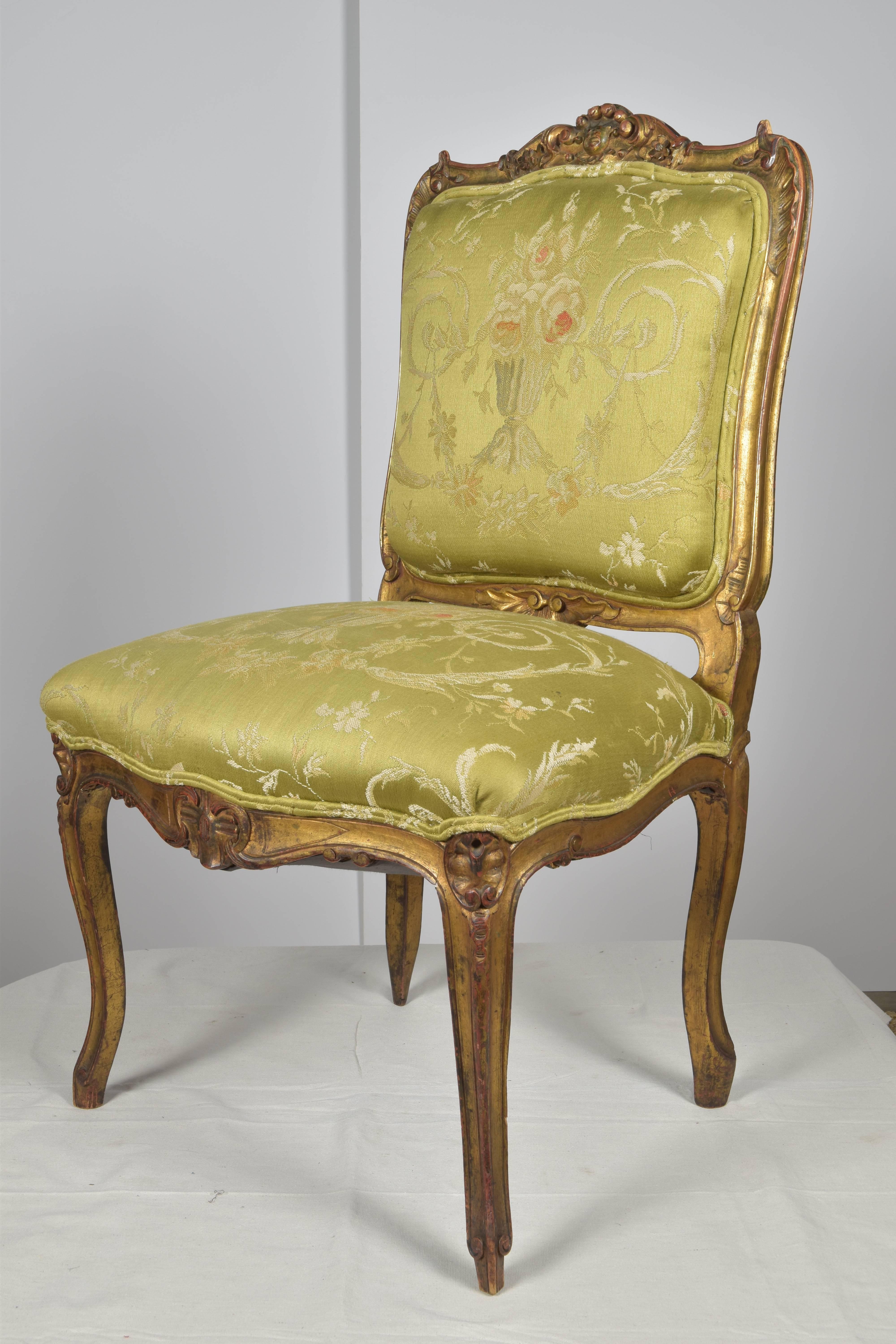 Lovely 19th century carved giltwood chair with carved flower and leaf and gently curved cabriole legs. Vintage green silk upholstery. Would be a lovely desk or vanity chair.