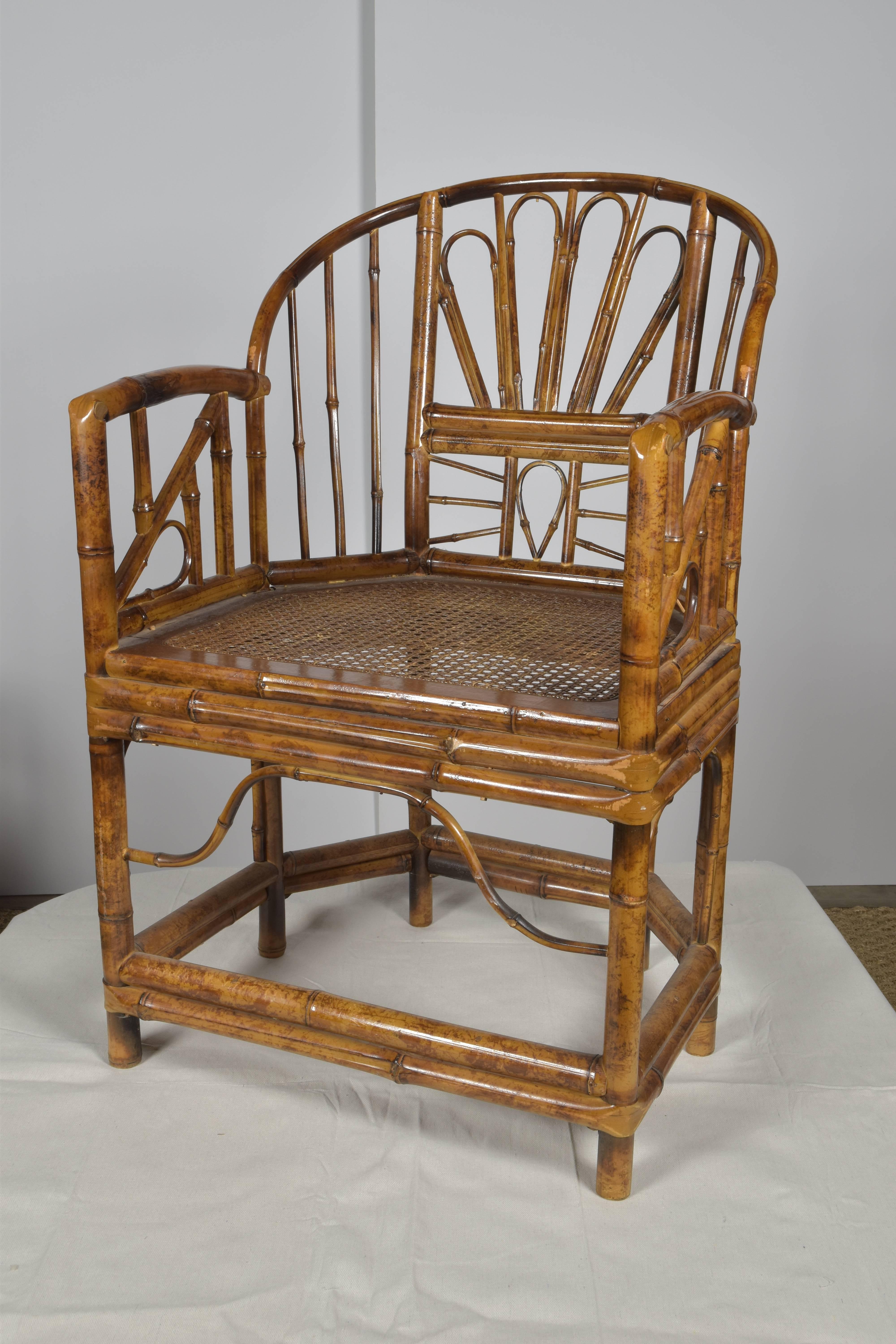 Pair of tortoise bamboo side chairs with original caned seats in the Chinese style.
