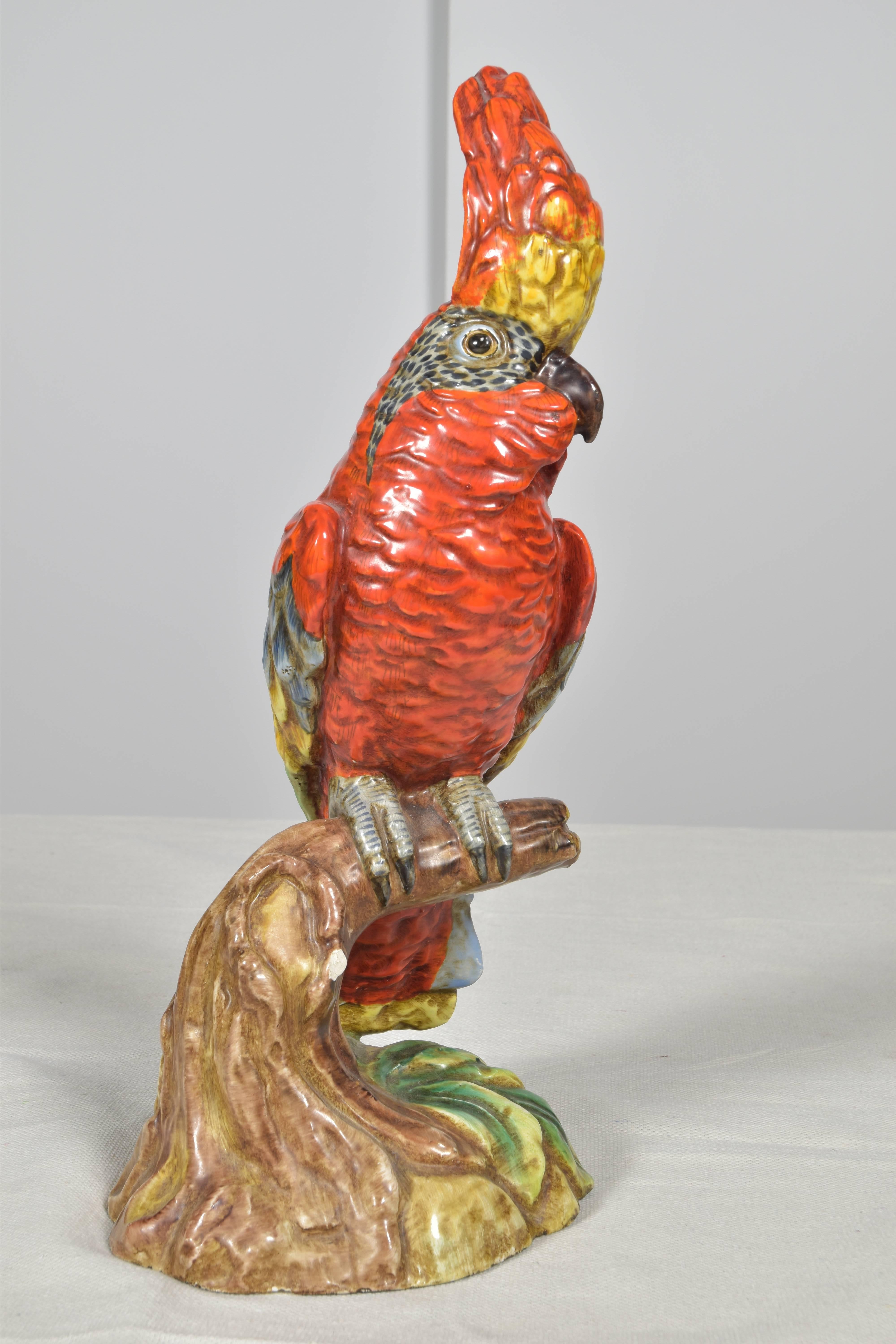 Charming pair of vintage Italian birds or parrots in vivid colors: red, green, yellow and brown.
