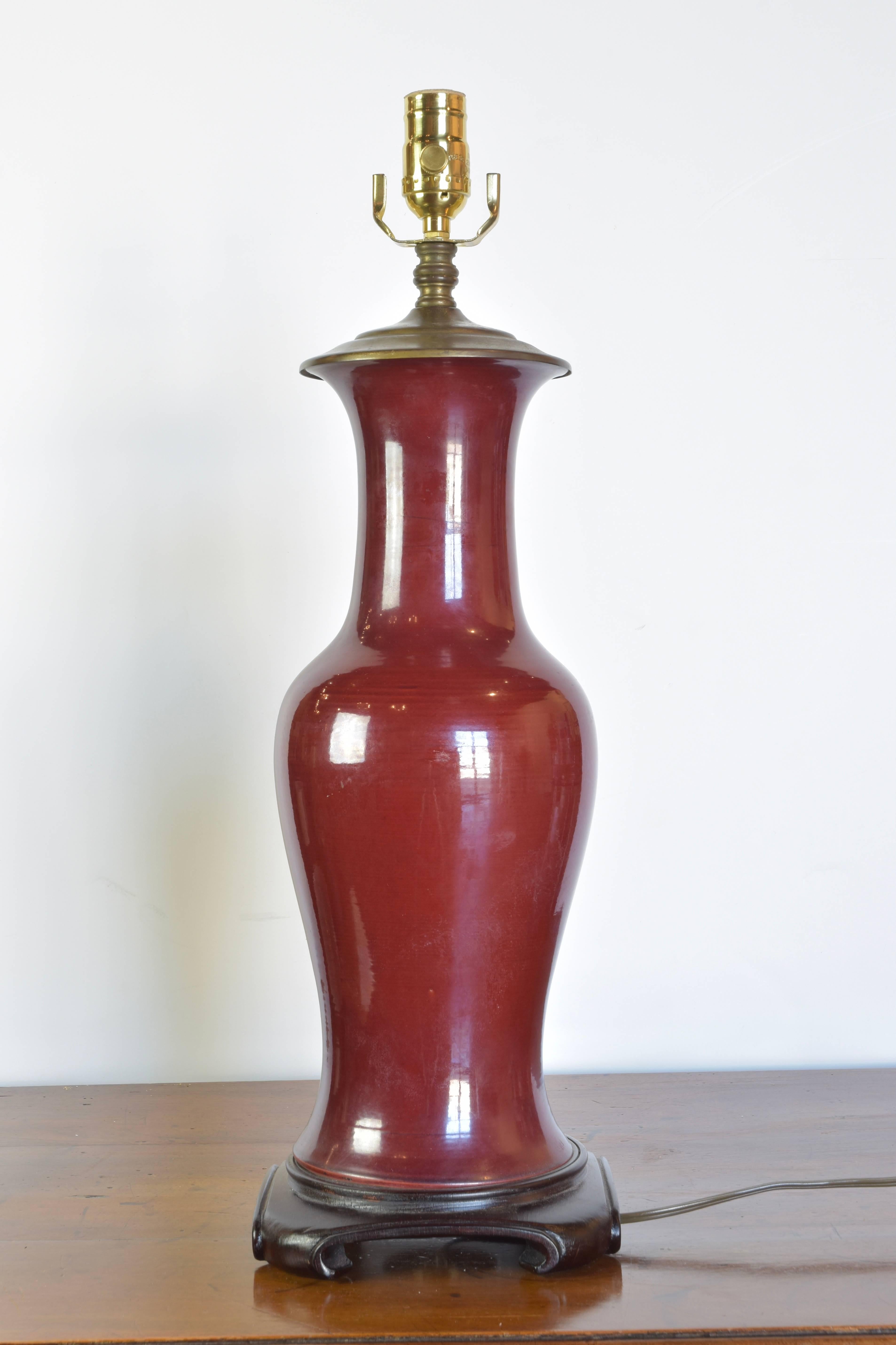 Stunning pair of 19th century Oxblood vases wired as lamps in the mid-20th century. There is slight variation in the height of this pair.

Lamps measure 29