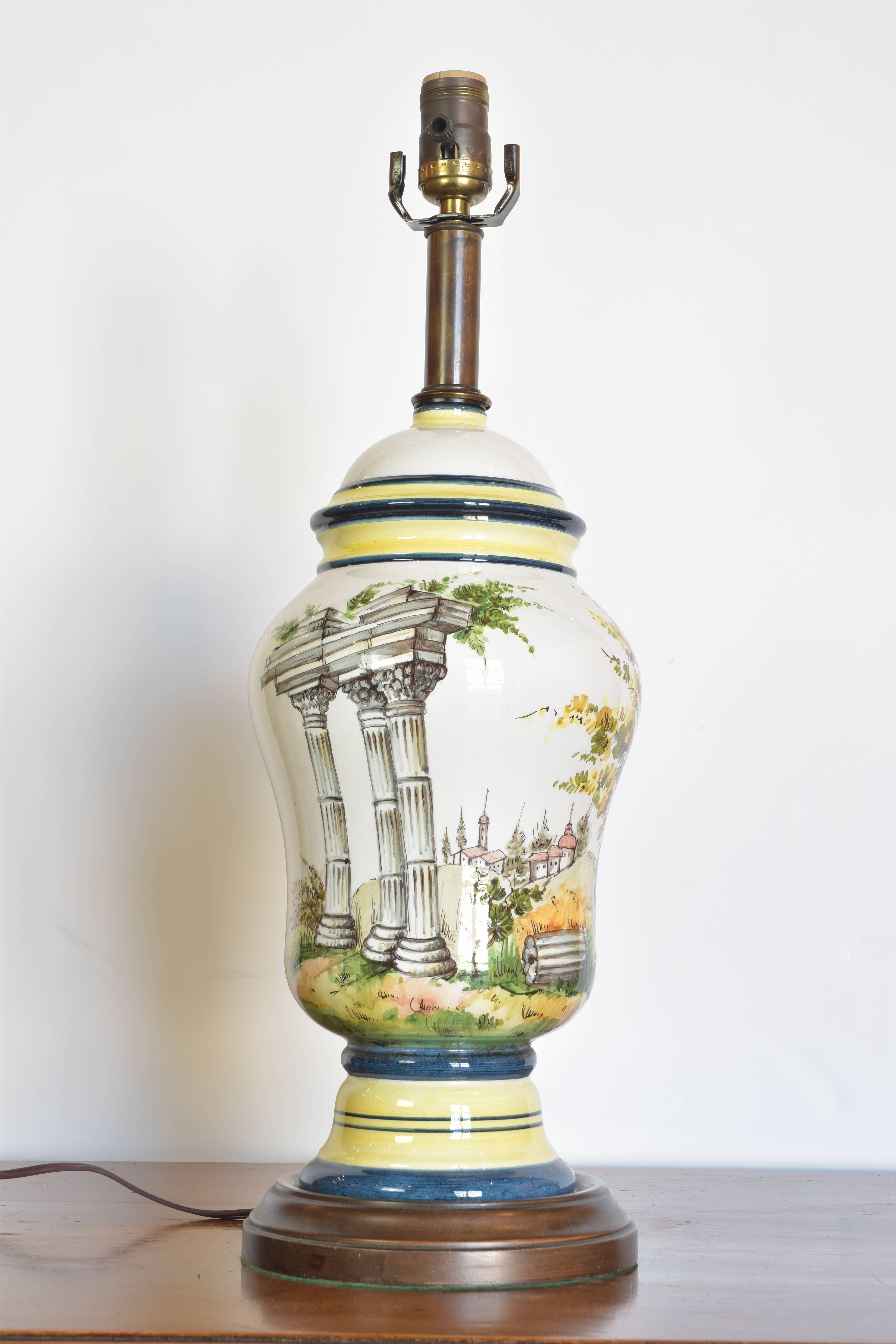 An assembled pair of Frederick Cooper table lamps with Greek column painted decoration. These Mid-Century lamps have been re-wired with new shades and are on their original base. There is a slight finish difference in the two pieces however they