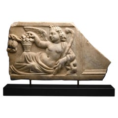 A Roman Marble Sarcophagus Lid Fragment of a Season, circa 3rd century AD