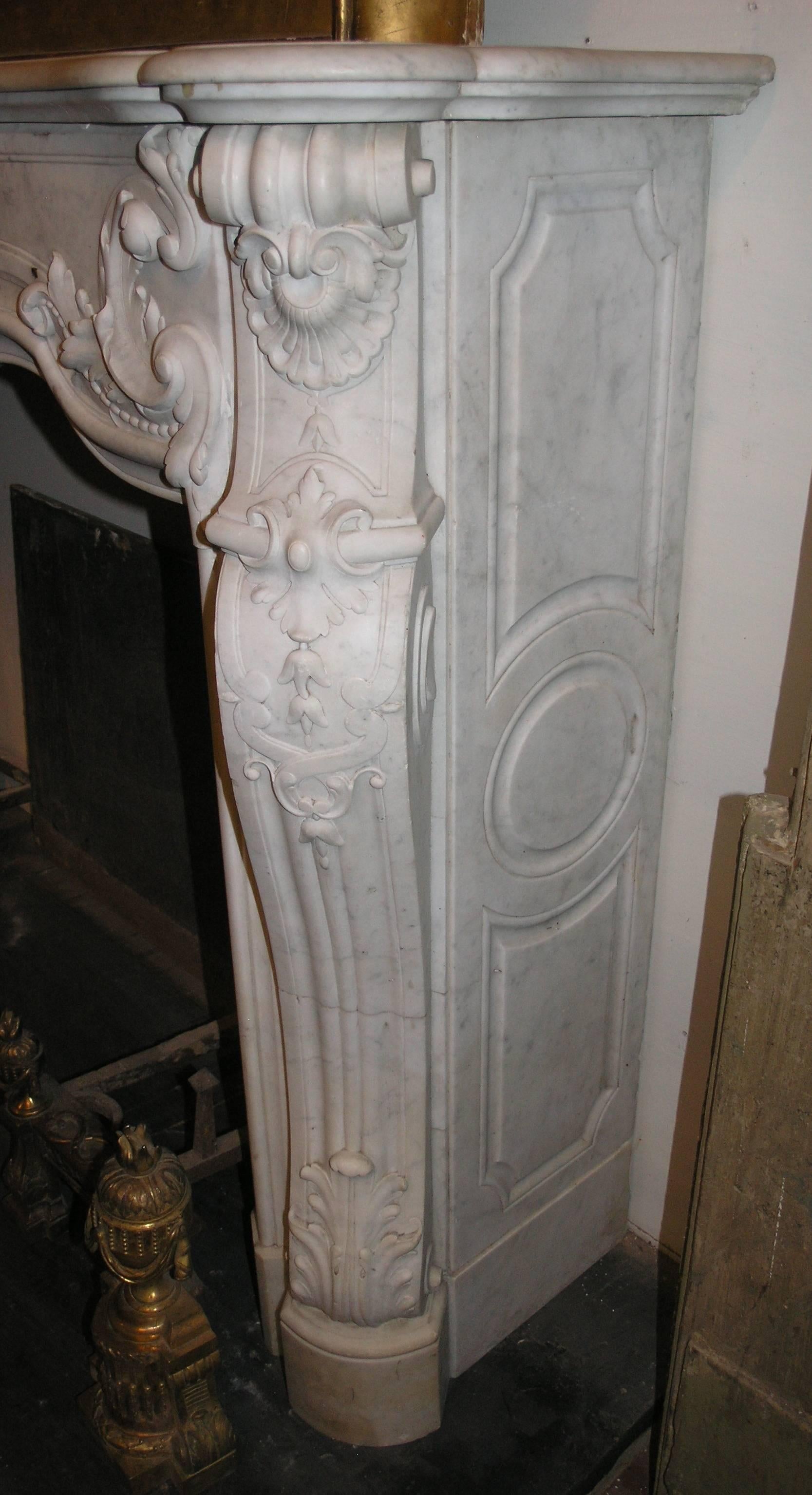 Antique rocaille marble fireplace.
