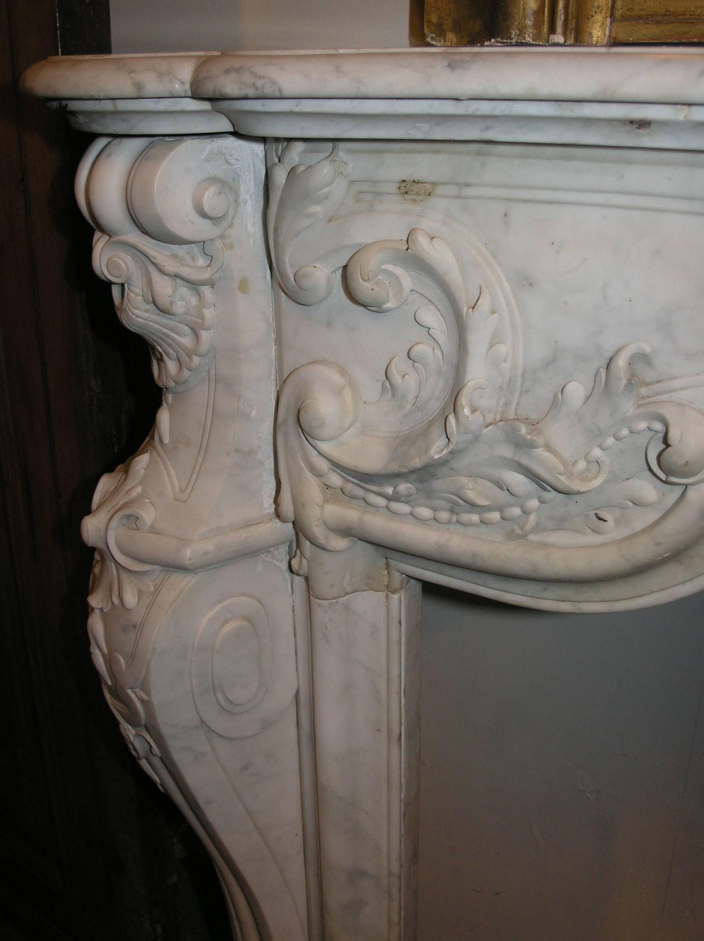 Early 18th Century Antique Rocaille Marble Fireplace