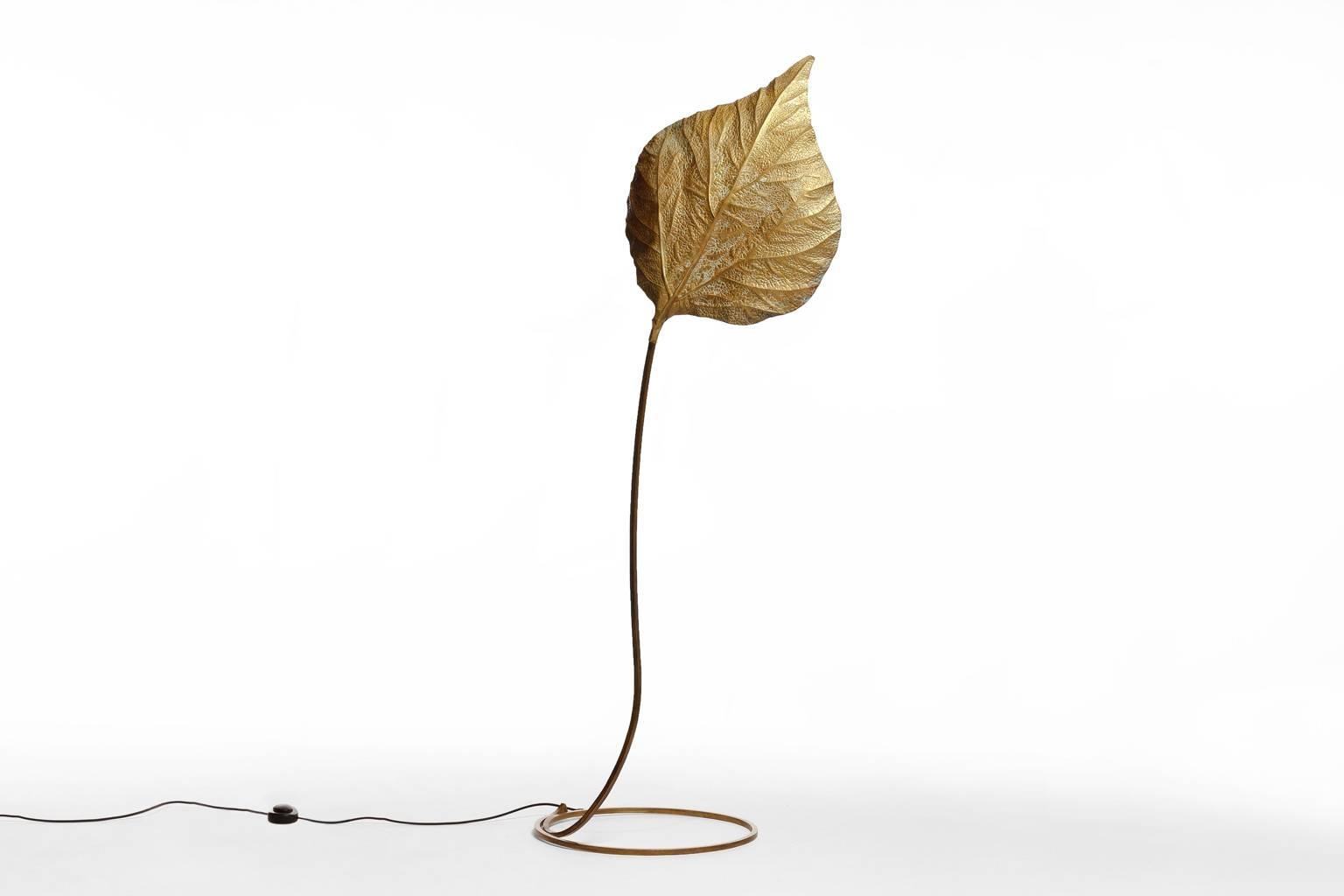 Huge Rhubarb leaf floor lamp by Tommaso Barbi, Italy 1960's. Beautiful Sensual and Elegant forms out of hammered brass. All handmade by the best Italian craftsmen. Provides a nice warm light due to the hammered brass surface.
In excellent condition