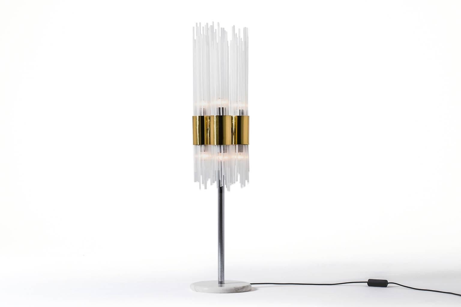 Impressive table, floor lamp, Italy, 1970s. Beautiful combination of clear and opal white glass tubes mounted in brass cylinders. Nice combination between the brass cylinders and the chrome base which is mounted on a beautiful piece of white marble
