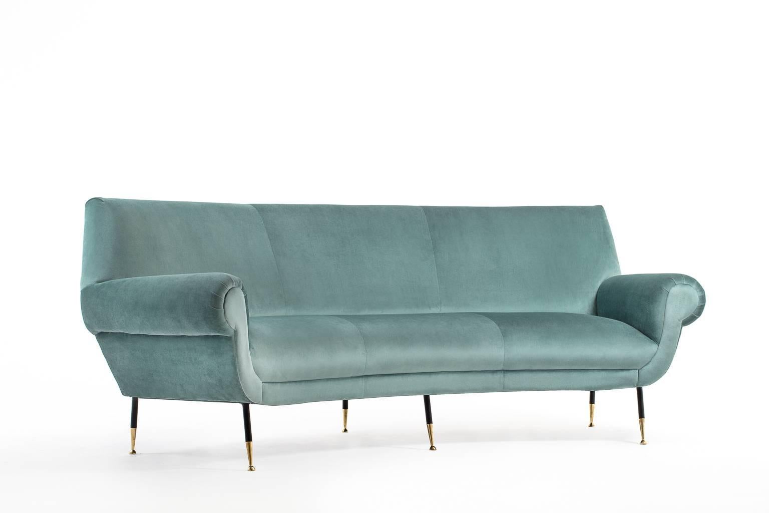 Stunning curved three-seat sofa by Gigi Radice for Minotti, Italy, 1950s. 
Reupholstered in a high quality aqua green velvet from the collection of Elitis Paris which provides a very chic and soft feeling. Very comfortable and relaxed seating. All