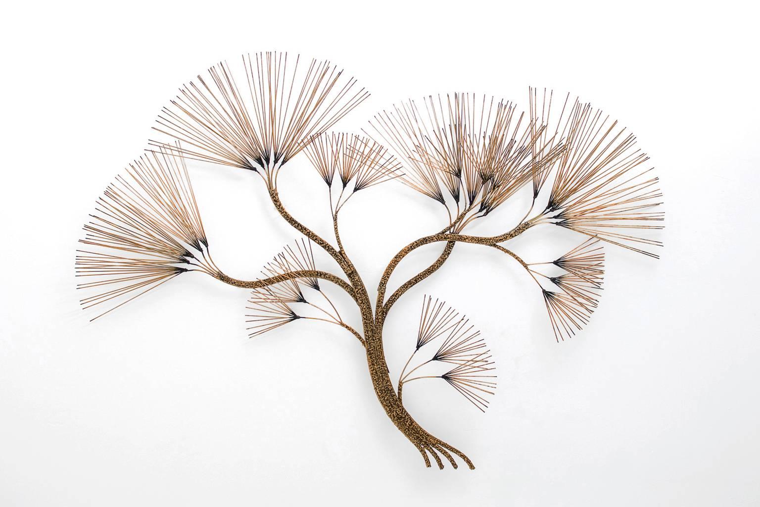 Brass wall sculpture by Curtis Jere, USA, 1970s. Very decorative and impressive piece imagine a tree/bush. Very well made with a beautiful structure on the branches and a nice overall warm patine on the brass. 
The sculpture hangs (5 cm) from the
