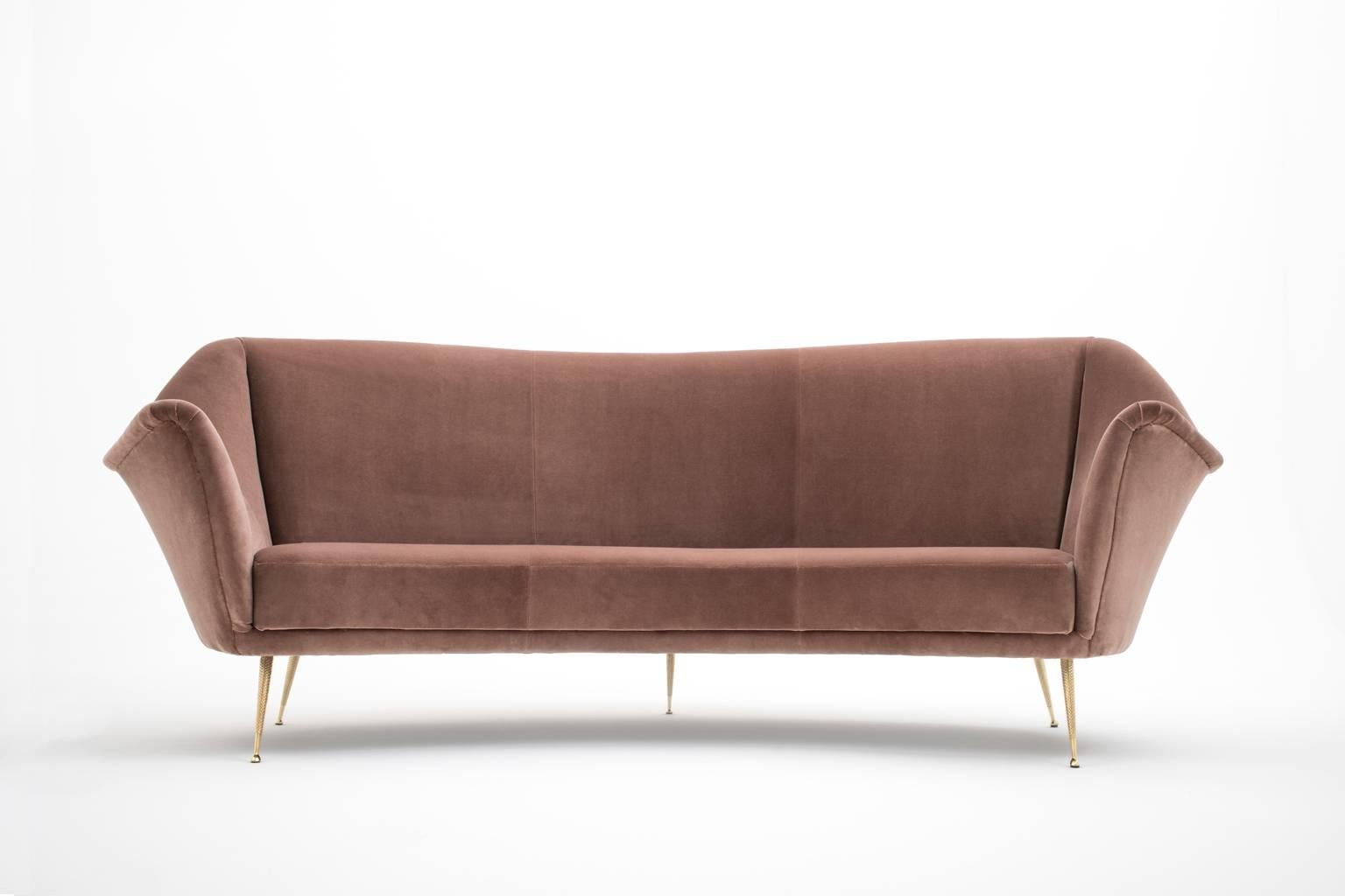 Stunning curved sofa by ISA Bergamo, Italy 1950s. Reupholstered in a high quality Mauve velvet which provides a nice warm and chic feeling. The sofa has nice distinctive solid brass feet with a geometric pattern. Very comfortable and relaxed