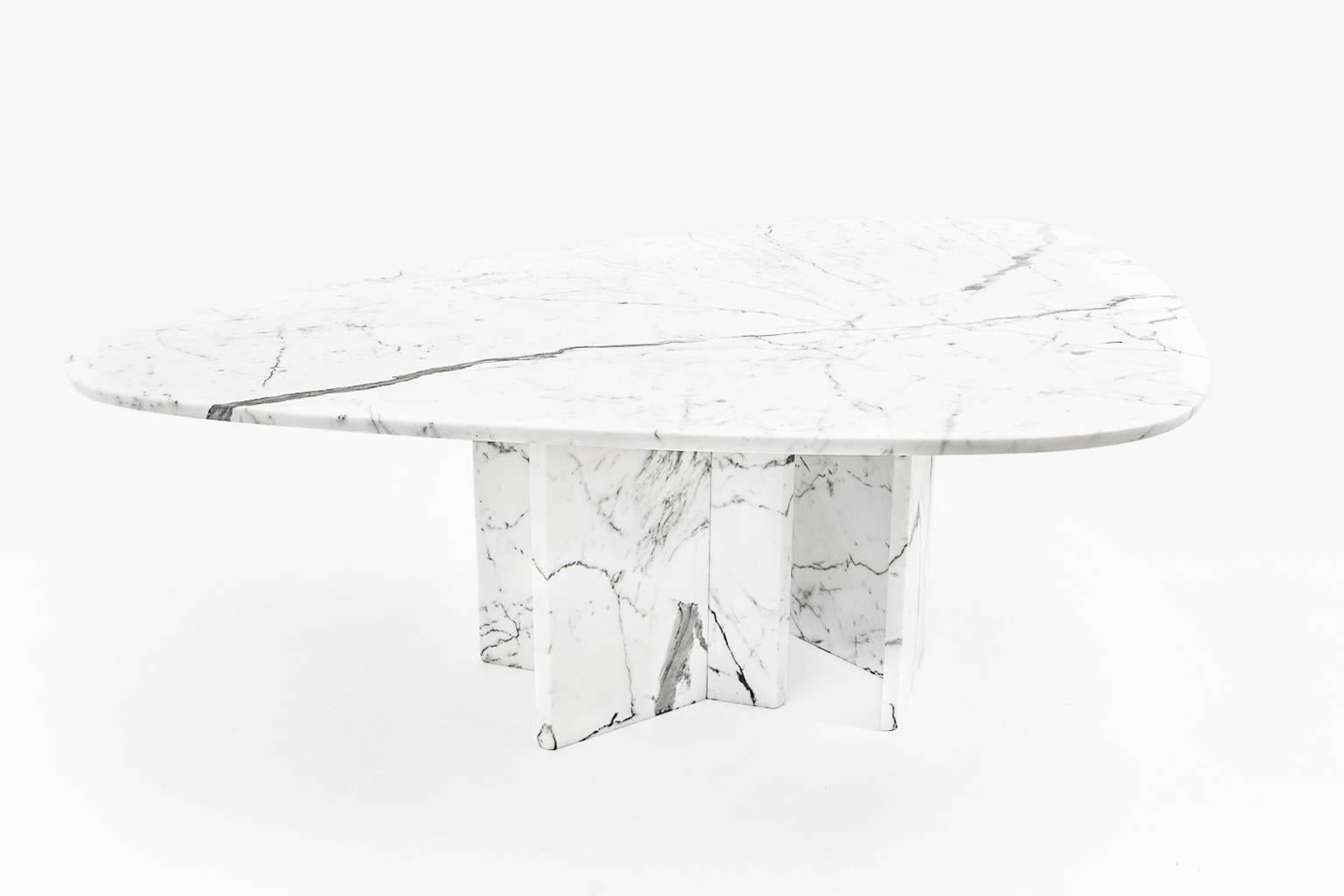 Huge triangular dining table by Belgium artist Willy Ballez, circa 1975.
Executed in Carrara marble with a spectacular grain, 3 cm thick. This table is custom made for a residence in Brussels. Another known example in black Granite (sold by Bonhams