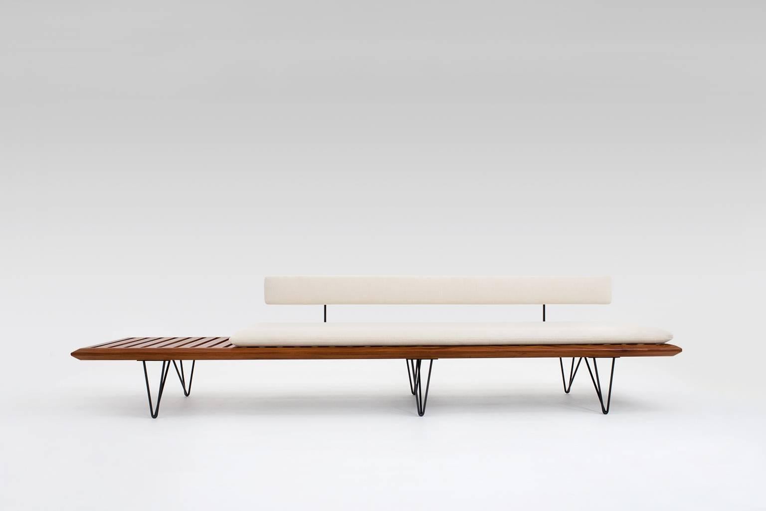 Extremely rare bench by Carlo Hauner and Martin Eisler for Forma, Brazil, 1950s. Made from fine solid Brazilian walnut with a beautiful grain and black metal legs. The backrest can be switched from side so you can choose to have the table section on