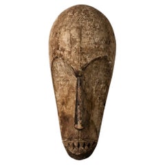 Masque ancien en bois libérien sculpté à la main, présentant une patine vieillie, Afrique de l'Ouest