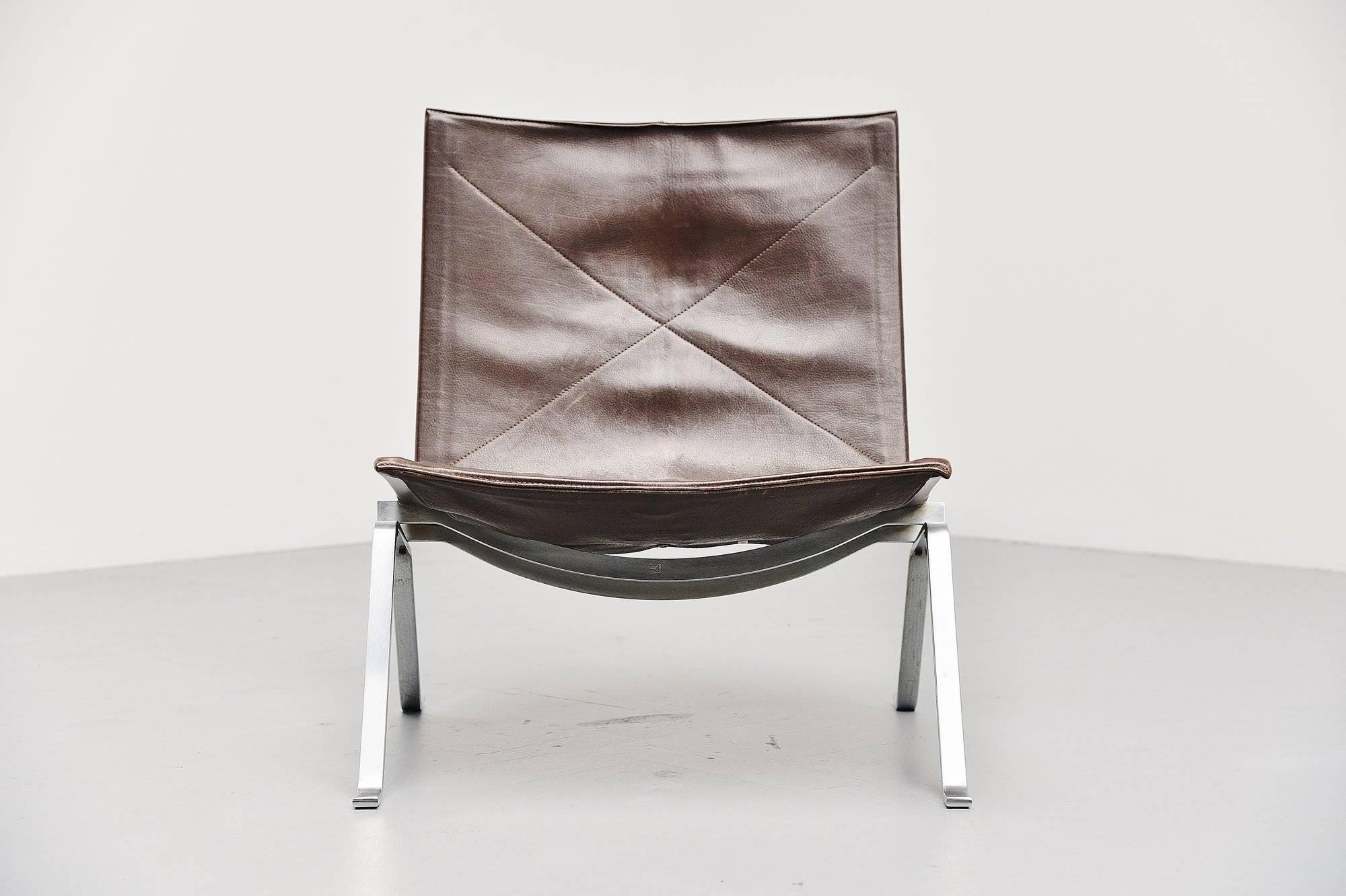 This is for a very nice example of the famous PK22 chair designed by Poul Kjaerholm for E Kold Christensen, Denmark, 1956. This model is an early edition with very nice dark brown patinated leather. The chair consisted of a spring steel structure,