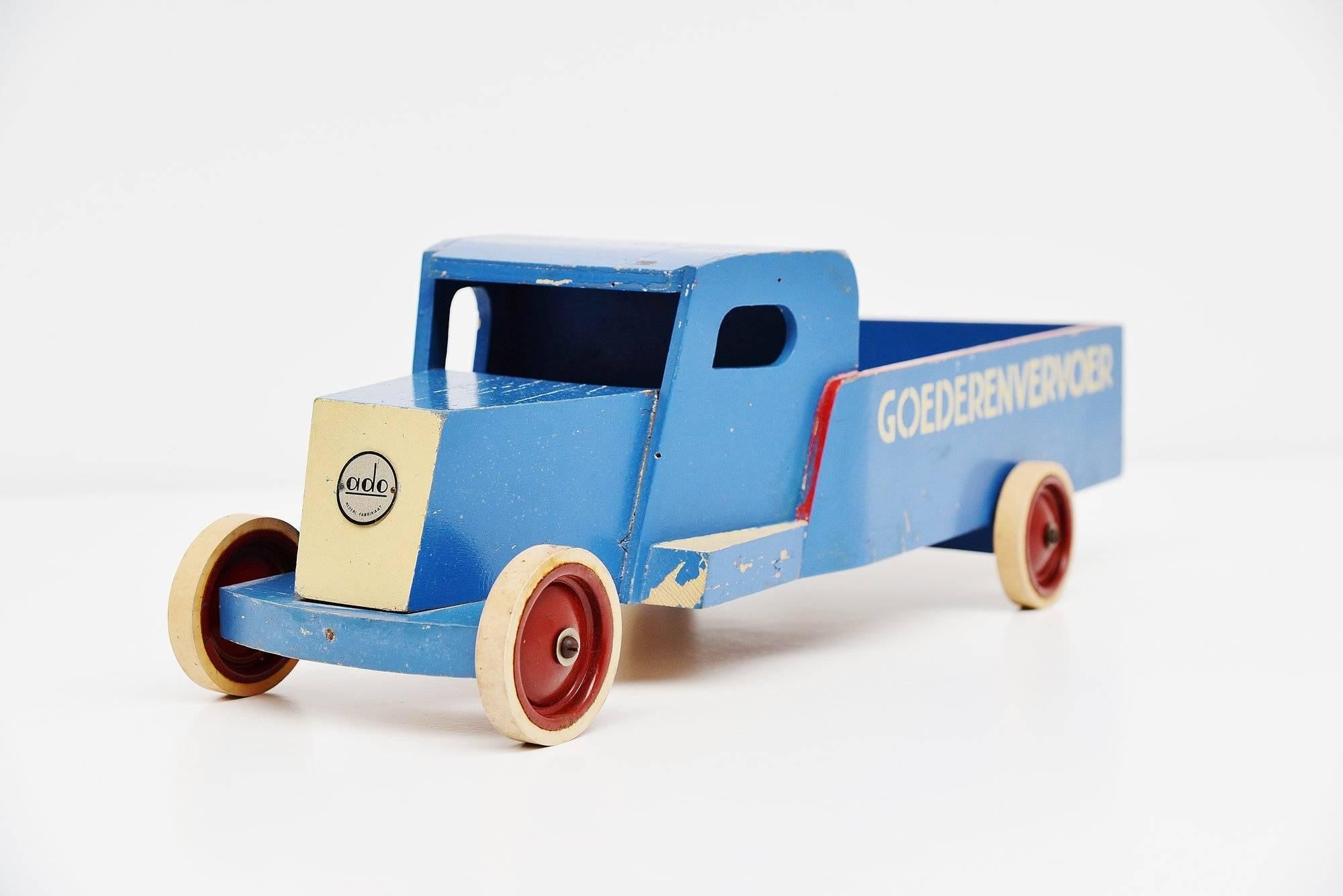 Very nice large toy goods transport (goederenvervoer) truck designed by Ko Verzuu for Ado Holland in circa 1940. Ado means Arbeid door onvolwaardigen, translated; labor by incapacitated, which makes this an even more special piece. Toys by Ado are