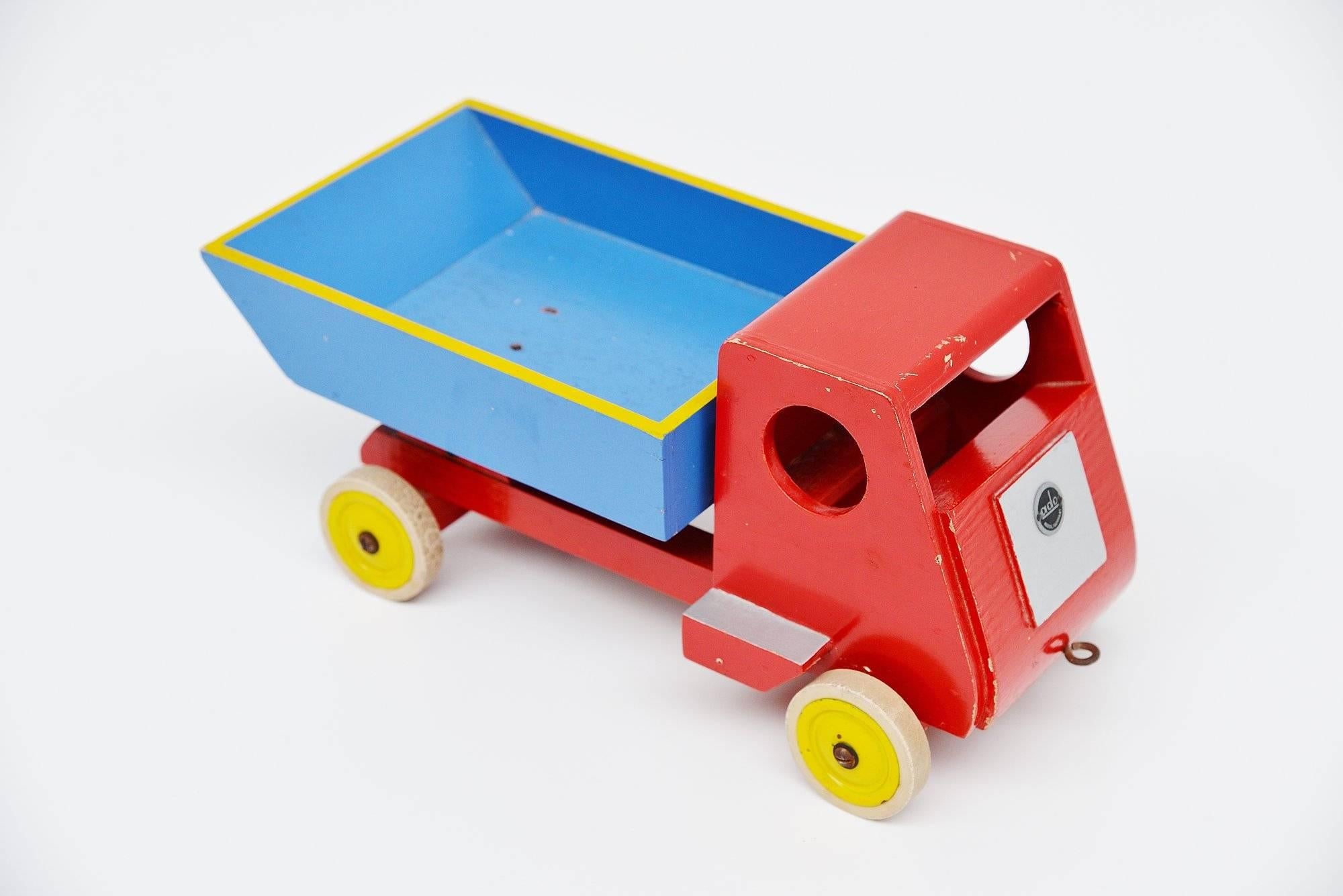 ery nice toy tilt truck designed by Ko Verzuu for Ado Holland in 1951. Ado means Arbeid door onvolwaardigen, translated; labor by incapacitated, which makes this an even more special piece. Toys by Ado are being highly collected at the moment, even
