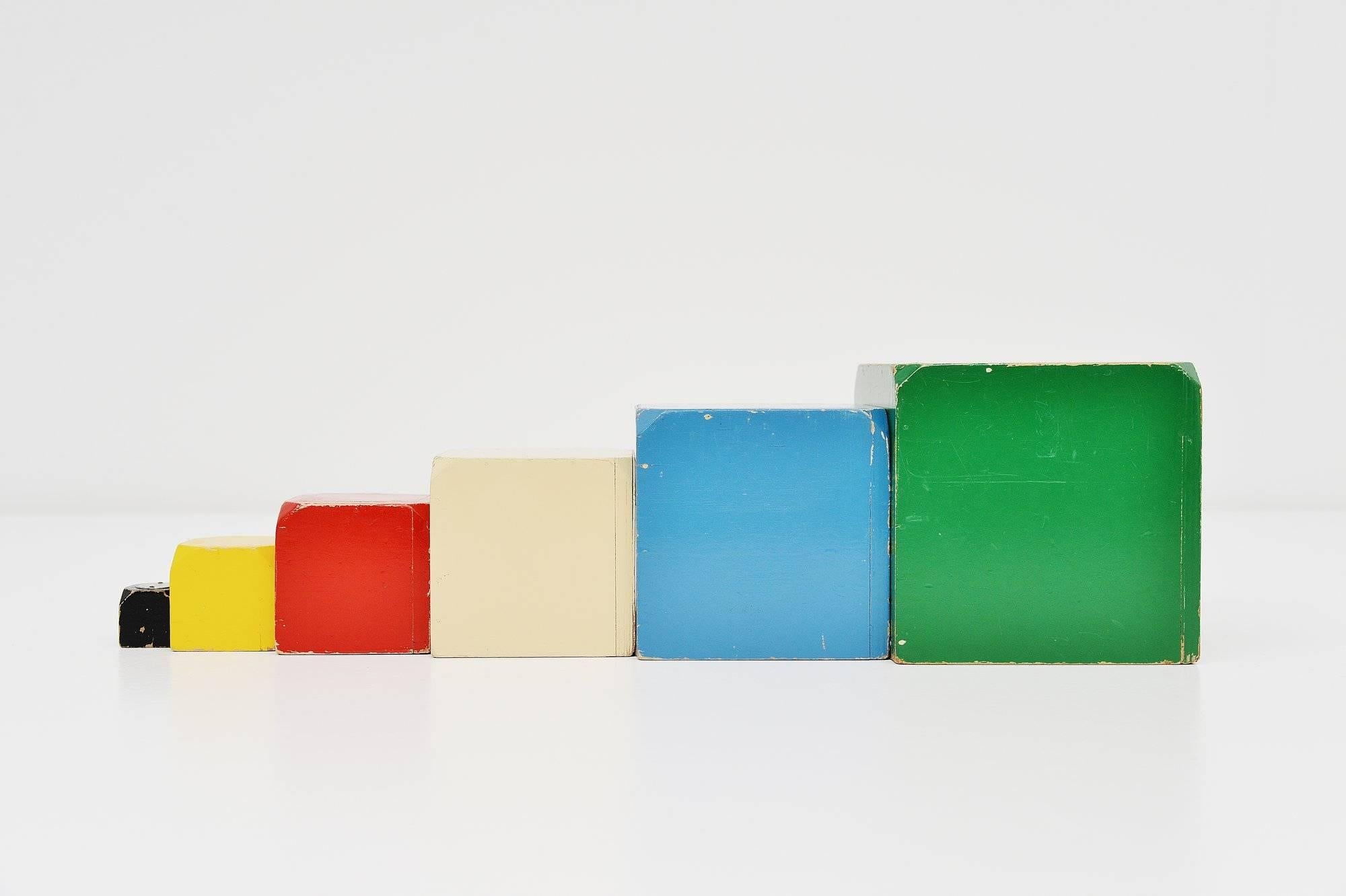 Very nice decorative wooden toy cubes set model 856, designed by Ko Verzuu for Ado Holland in the 1950s. Ado means Arbeid door onvolwaardigen, translated; labor by incapacitated, which makes this an even more special piece. Toys by Ado are being