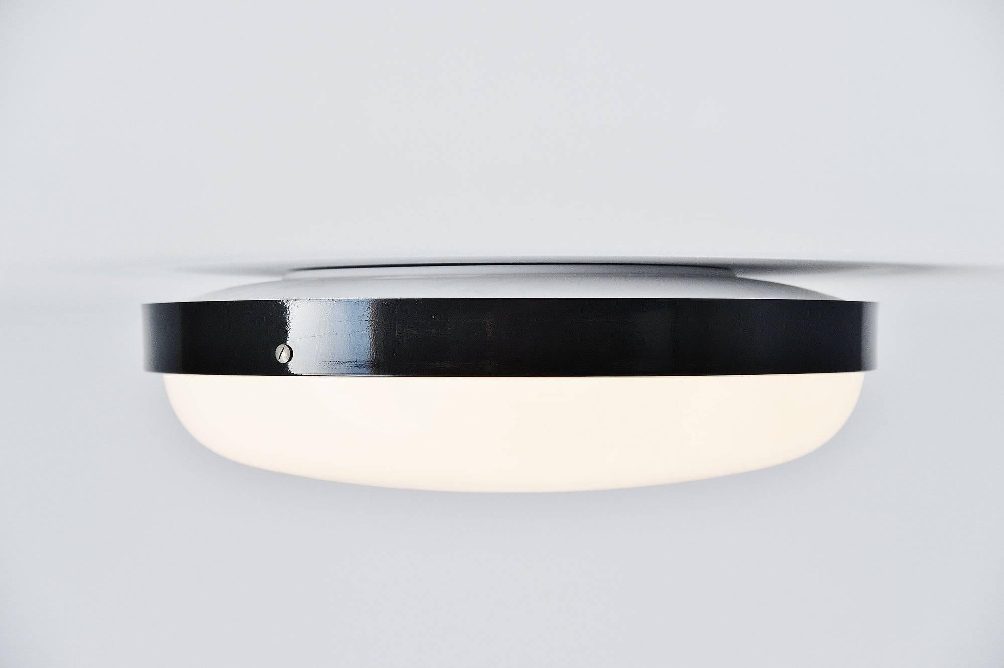 Large ceiling lamp model 3001/4 designed by Gino Sarfatti, manufactured by Arteluce, Italy 1950. This light exists in three parts, a white lacquered frame, with a white plexi shade and a very dark grey aluminum diffuser ring. This lamp is documented