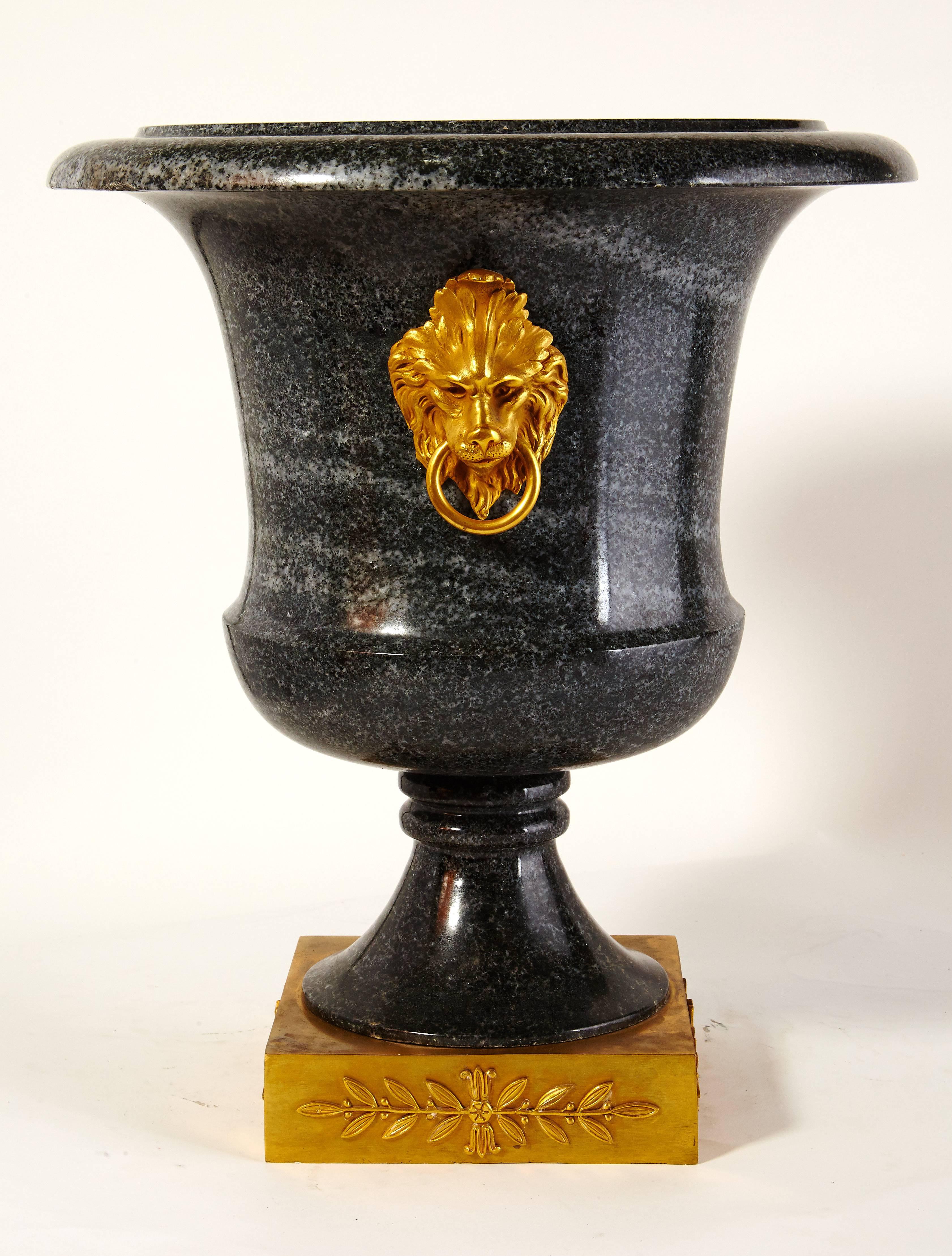 Carved Pair of Large Neoclassical Green Granite and Gilt Bronze Urns For Sale