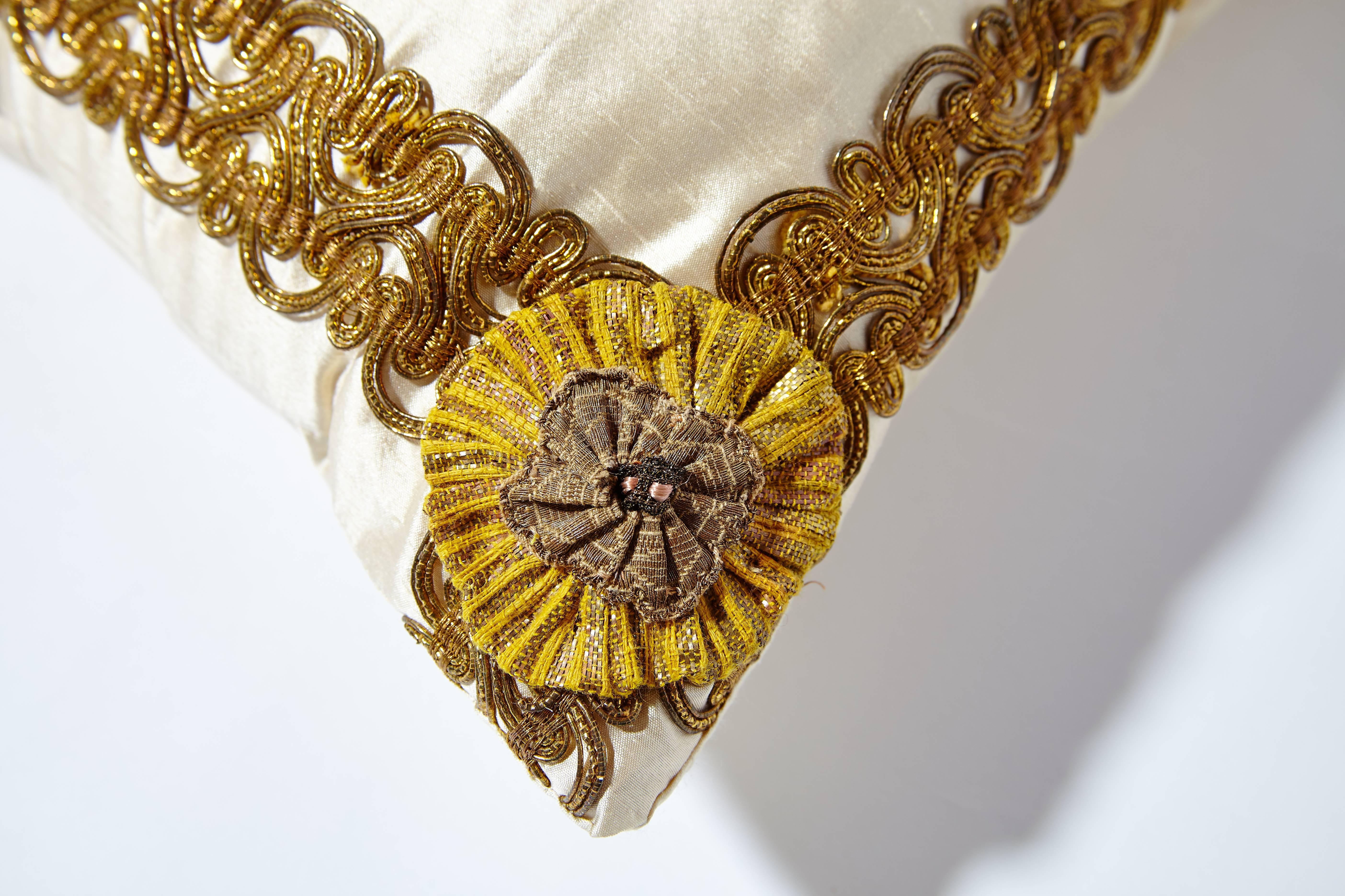 18th century Italian fragment of brocaded lampas in silk and gold thread representing polychrome flowers. The beautifully ornate concentric frames of trim is a rare 19th century Italian galloon (trim) and each corner is embellished with handmade