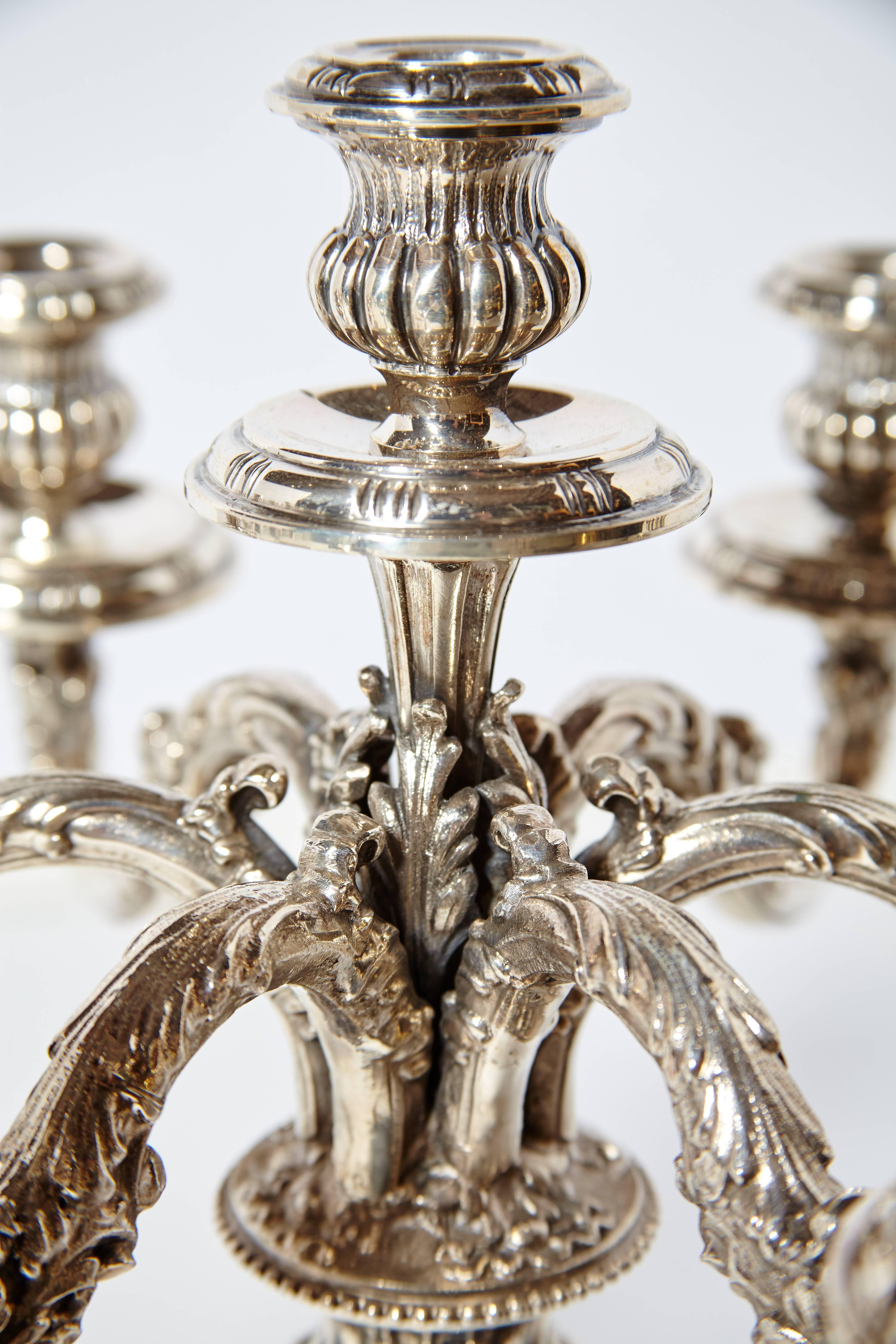 Pair of beautifully hand chased 20th century Italian 800 silver candelabras. Fully marked. Each candelabra holds eight candles. Total weight of both candelabras is 164 troy ounces.