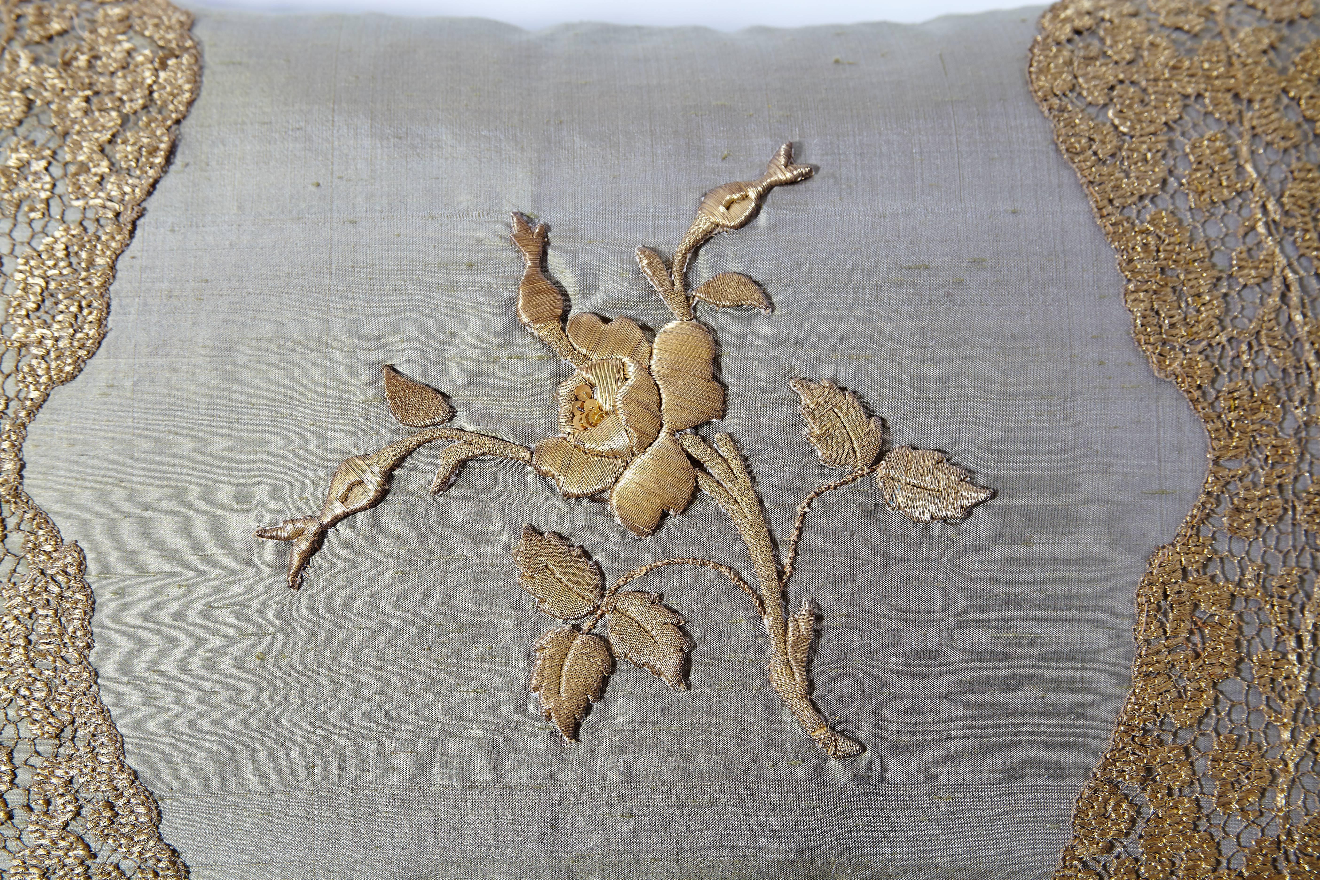 19th century Italian raised gold metallic embroidery of rose and leaves hand sewn on Italian pale green silk.  Two rare fragments of scalloped 19th century French handmade metallic thread pillow lace complete this pillow. Handcrafted by an Italian
